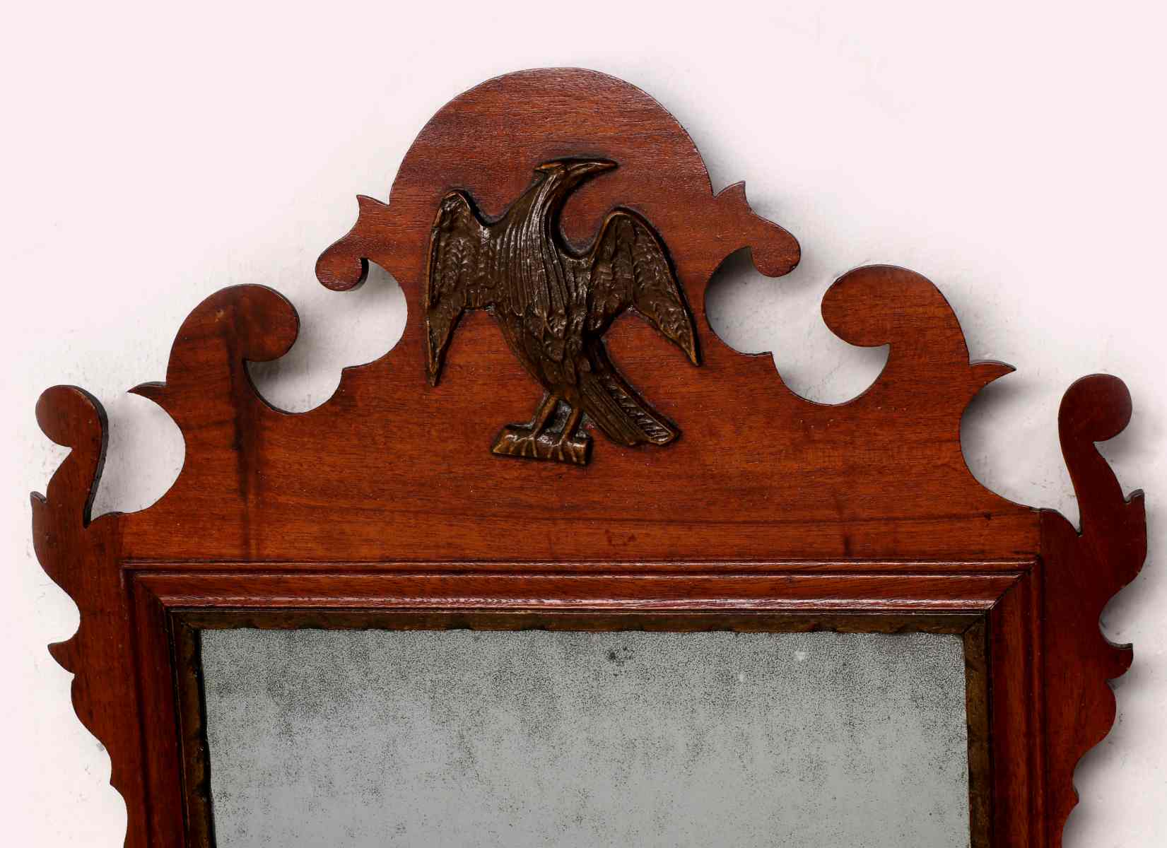 A CIRCA 1800 SCROLL CUT CHIPPENDALE STYLE MIRROR