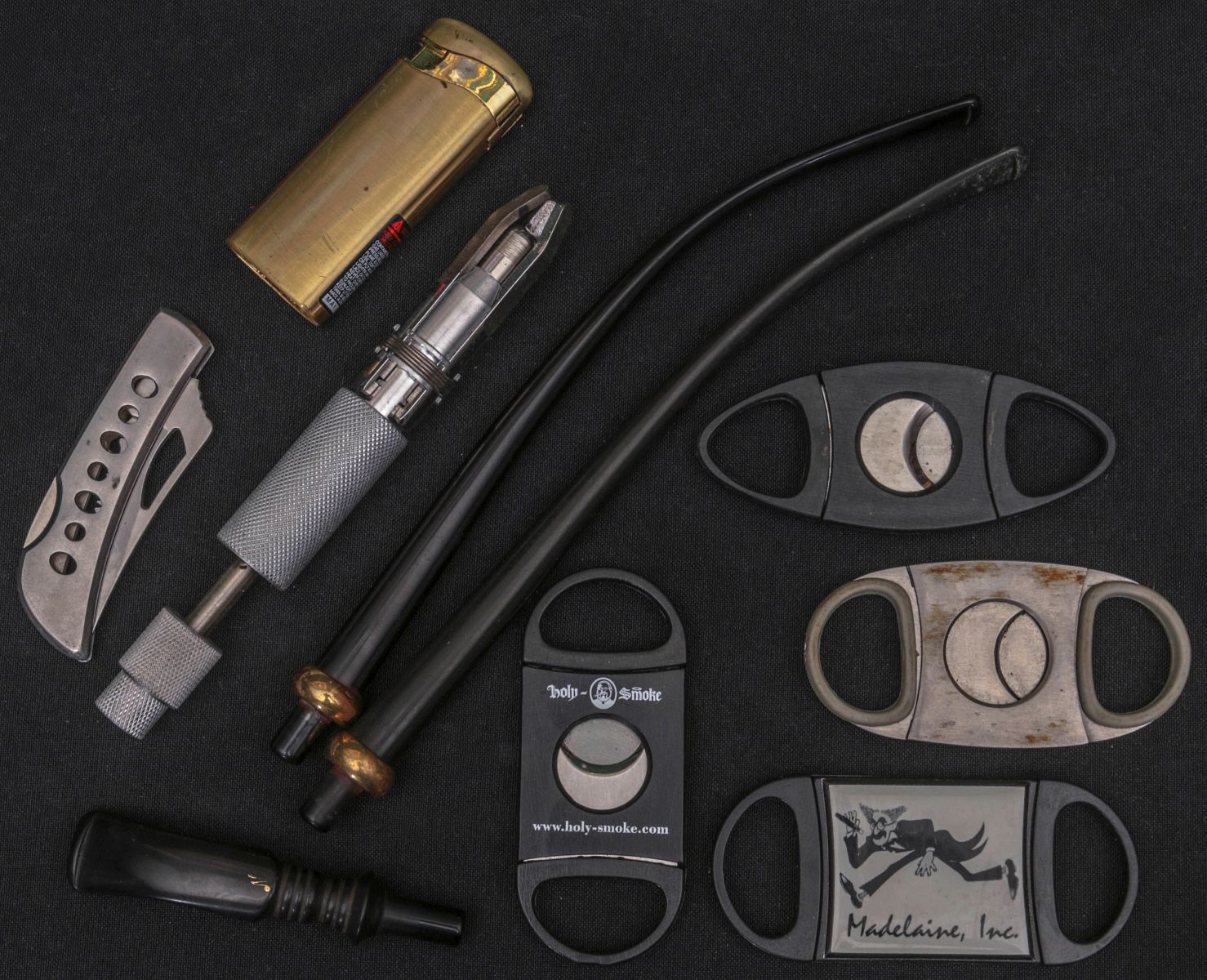 A GROUP OF TOBACCO SMOKING ACCESSORIES