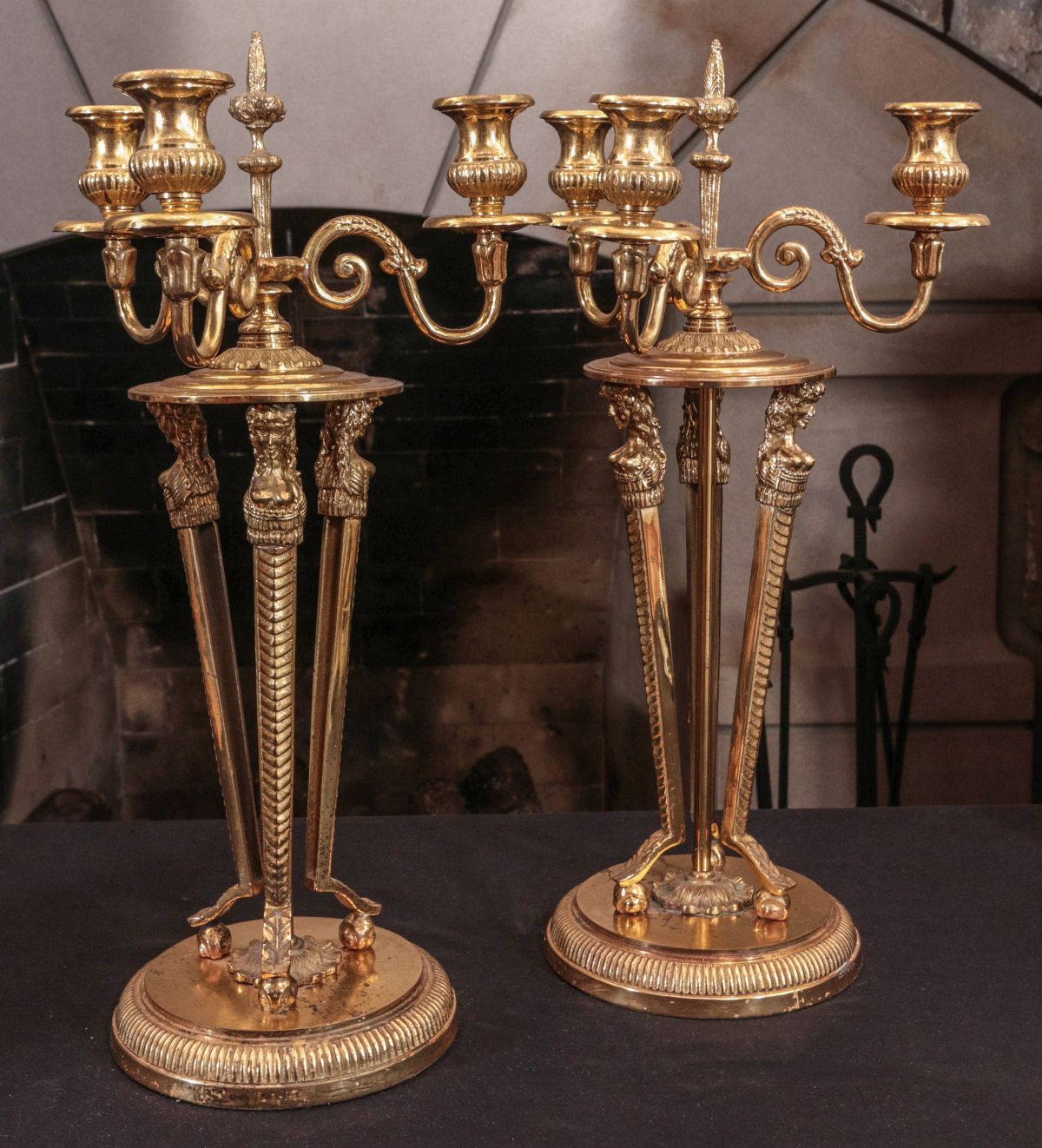 A PAIR BRASS THREE LITE CANDLESTICKS