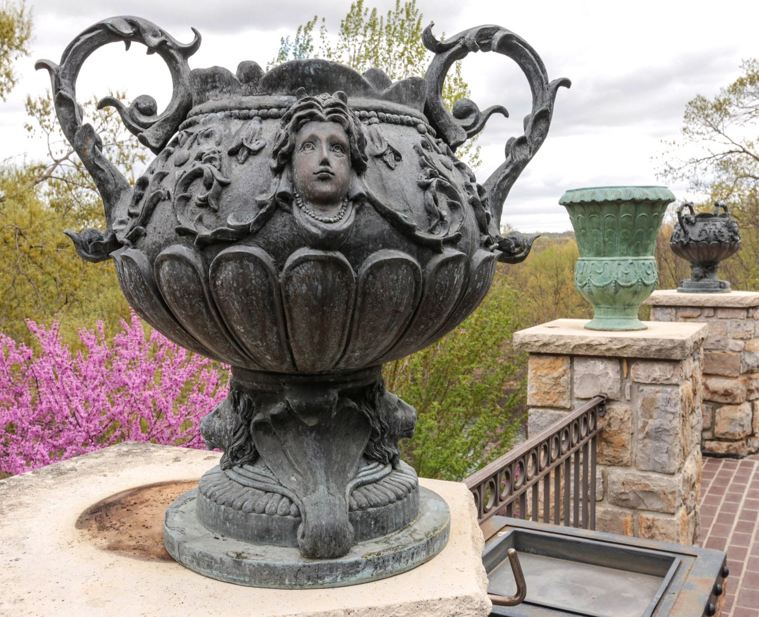 A PAIR 26-INCH BRONZE GARDEN URNS WITH HANDLES