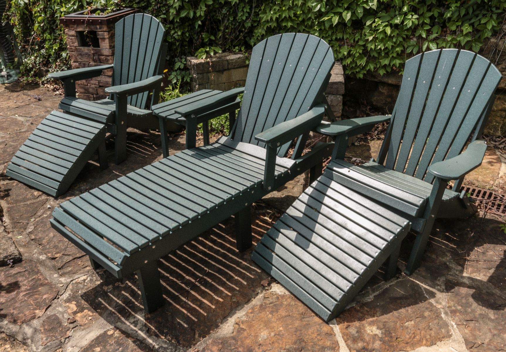 A SUITE OF 20TH C. ADIRONDACK TYPE PATIO FURNITURE