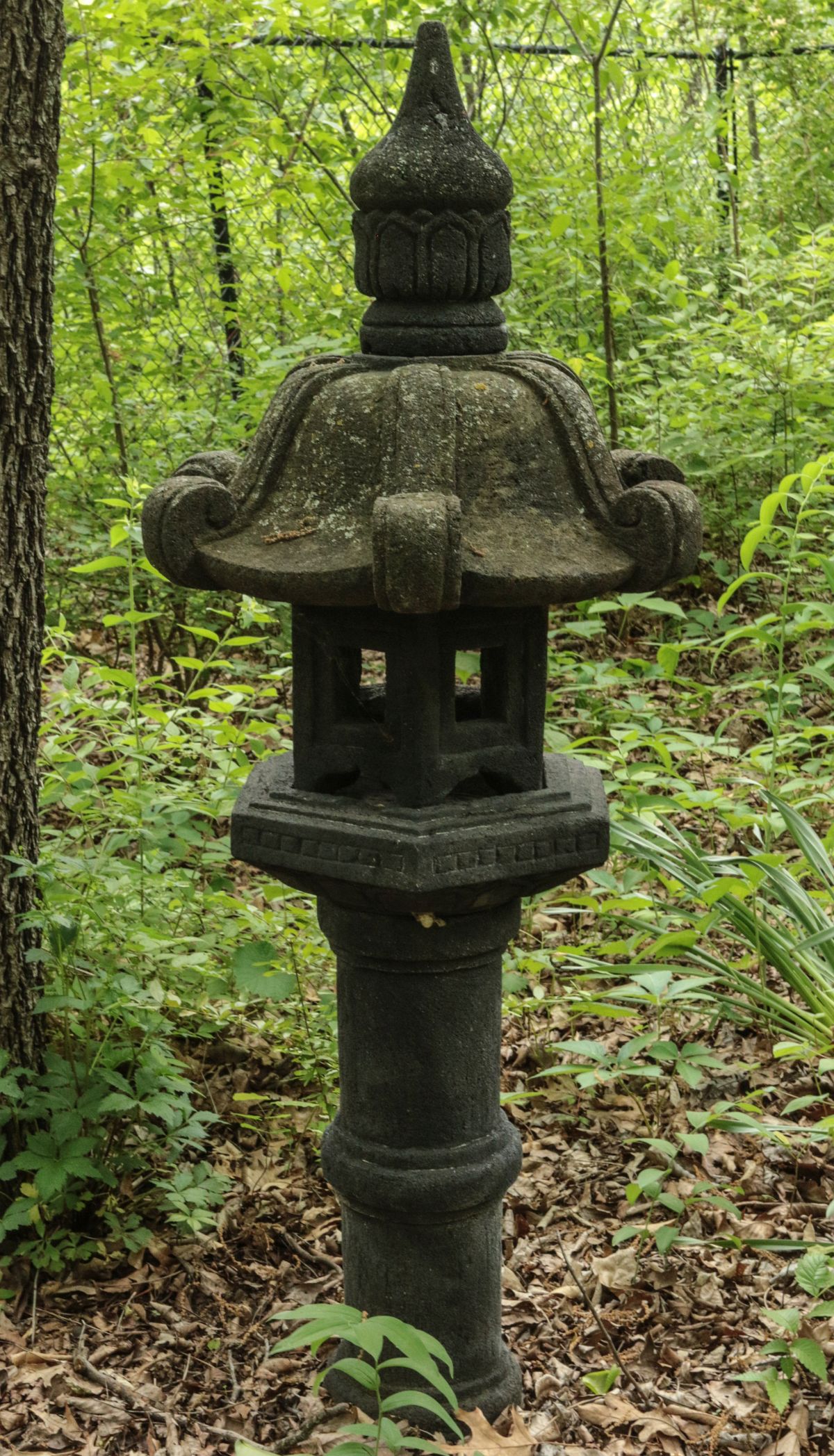 A CAST CONCRETE PAGODA GARDEN ORNAMENT