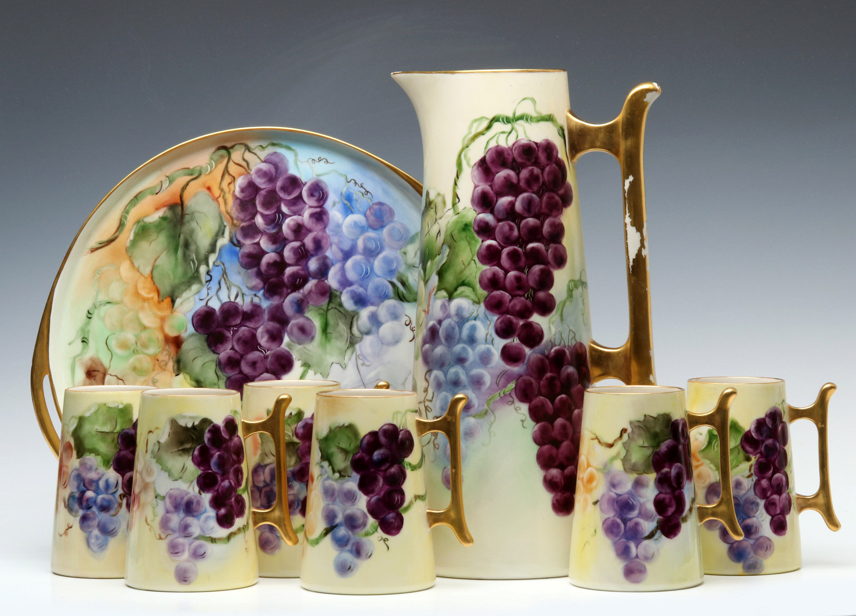 A LARGE AMERICAN BELLEEK HAND PAINTED TANKARD SET