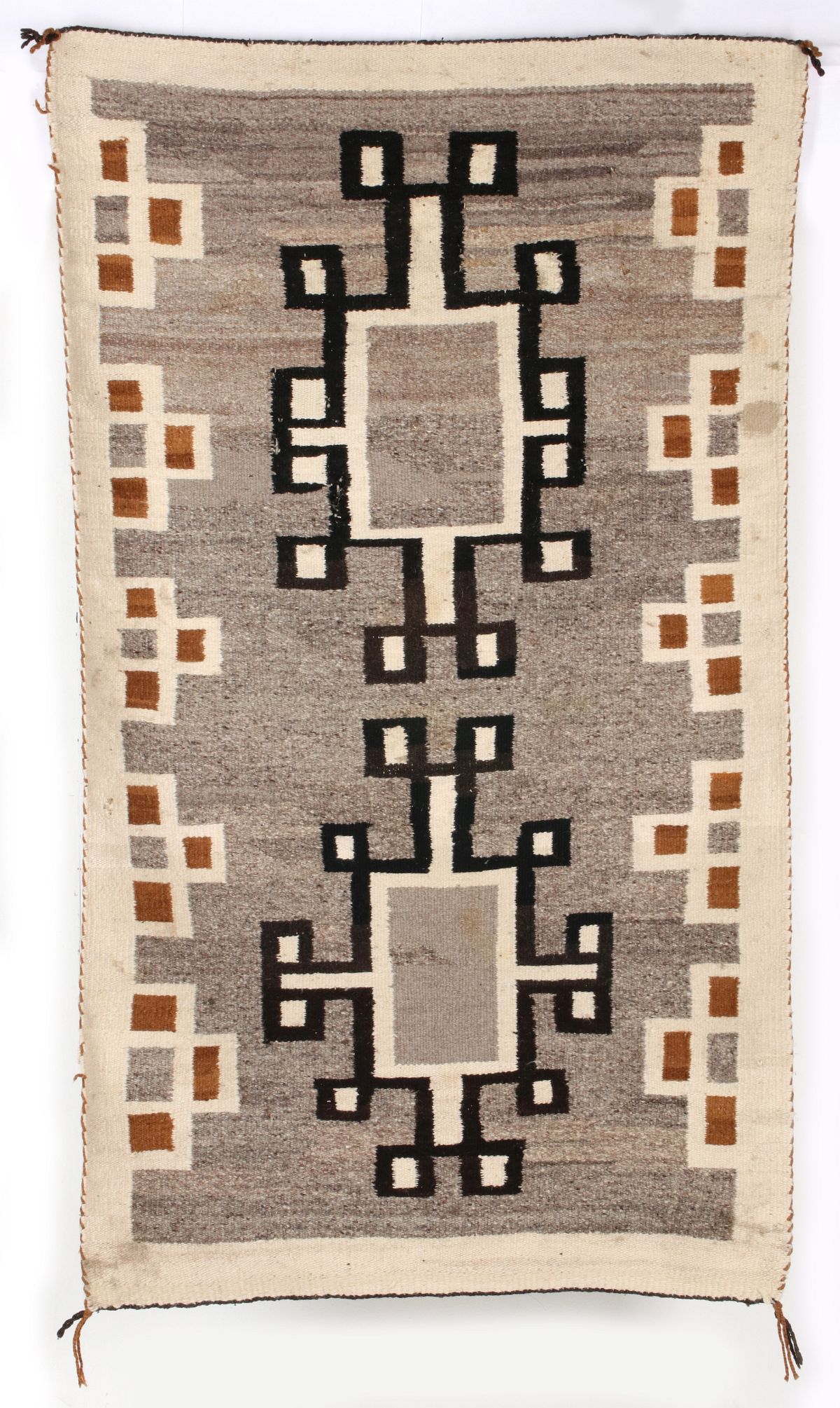 AN EARLY 20TH CENTURY NAVAJO CRYSTAL WOOL WEAVING