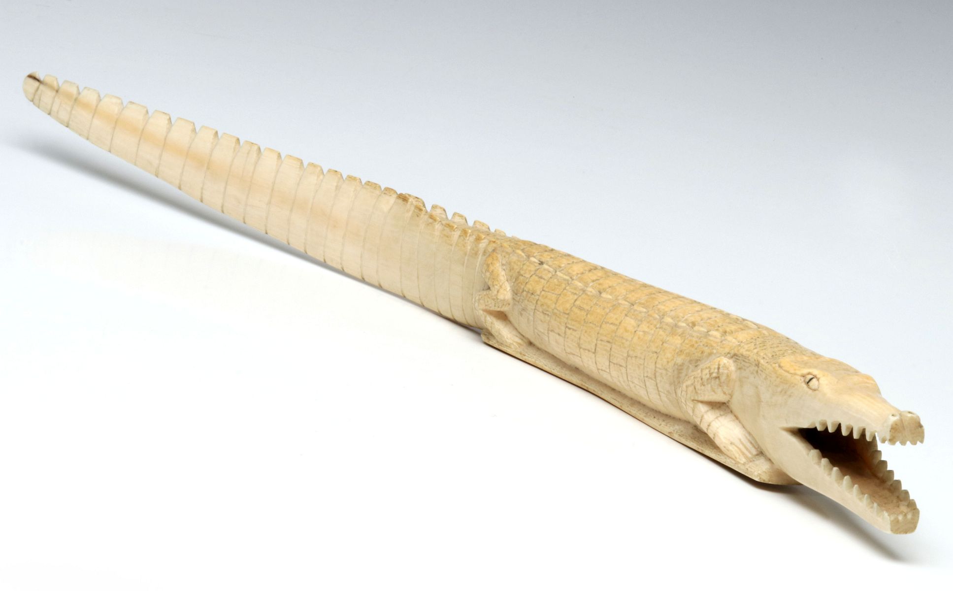 #268A: A MID 20TH CENTURY CARVED IVORY ALLIGATOR SCULPTURE