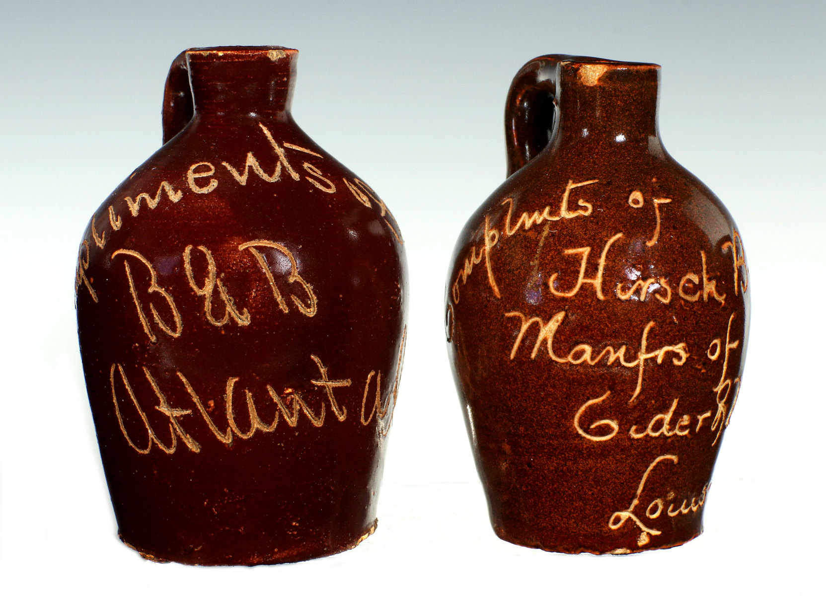 TWO CIRCA 1900 SCRATCH STONEWARE ADVERTISING MINI JUGS