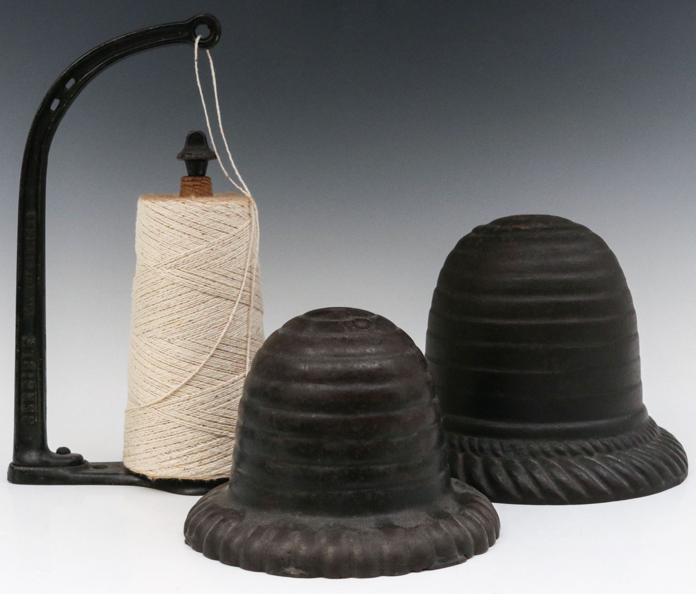 THREE DIFFERENT CIRCA 1900 CAST IRON STRING HOLDERS