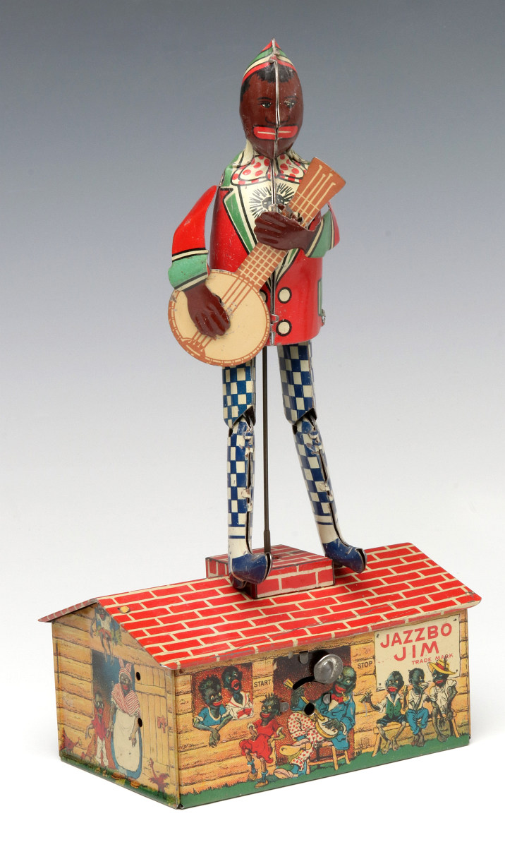 A STRAUSS JAZZBO JIM LITHOGRAPH TIN WIND UP DANCER TOY