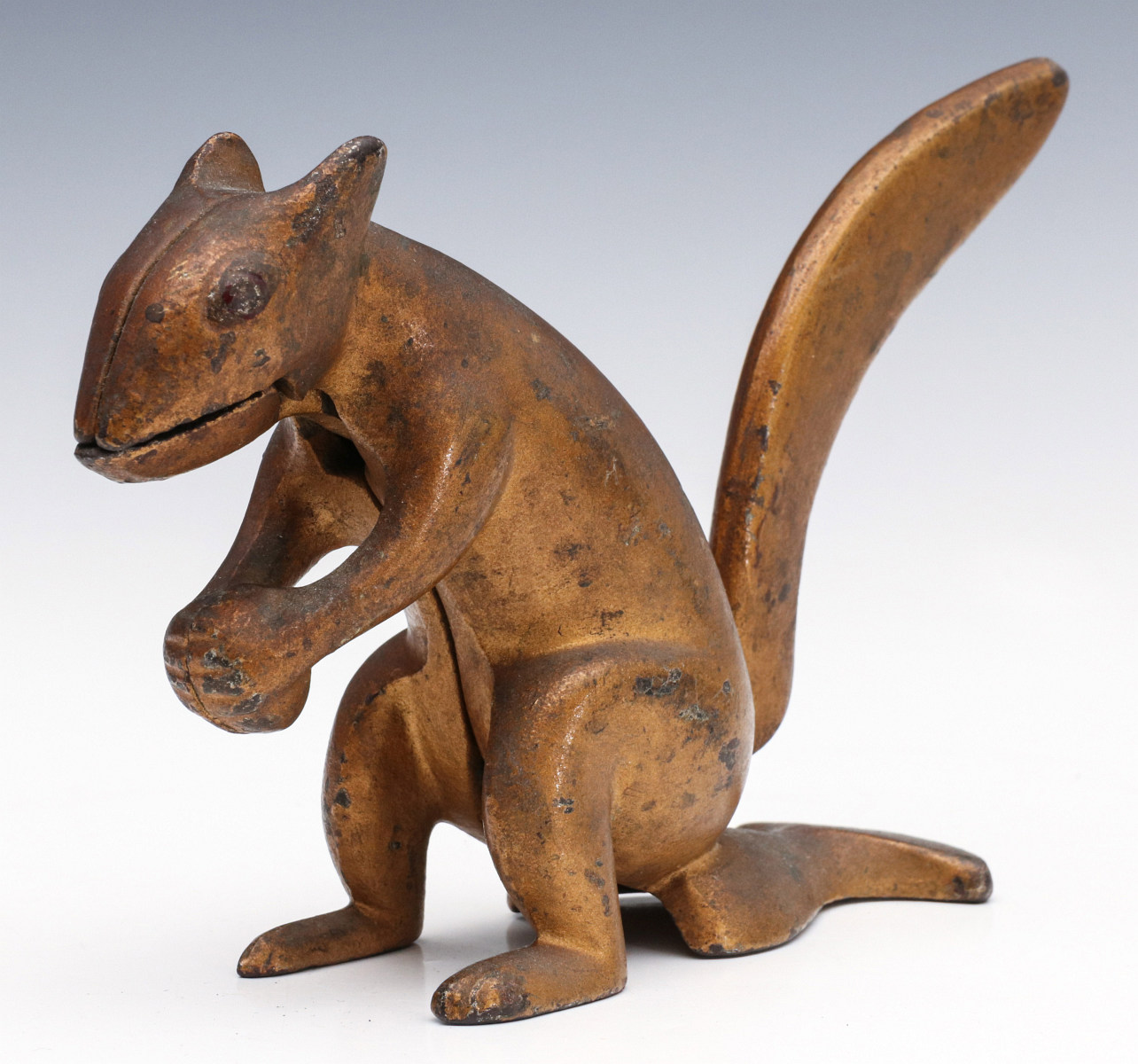 AN UNUSUAL STYLIZED SQUIRREL CAST IRON NUT CRACKER