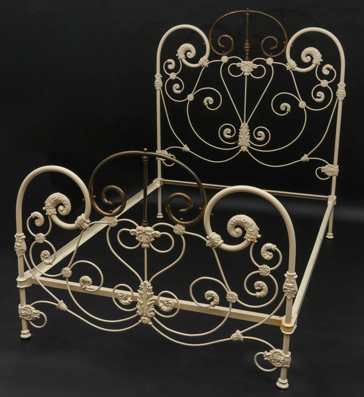 AN EXCEPTIONAL ORNATE IRON BED WITH BRASS EMBELLISHMENT