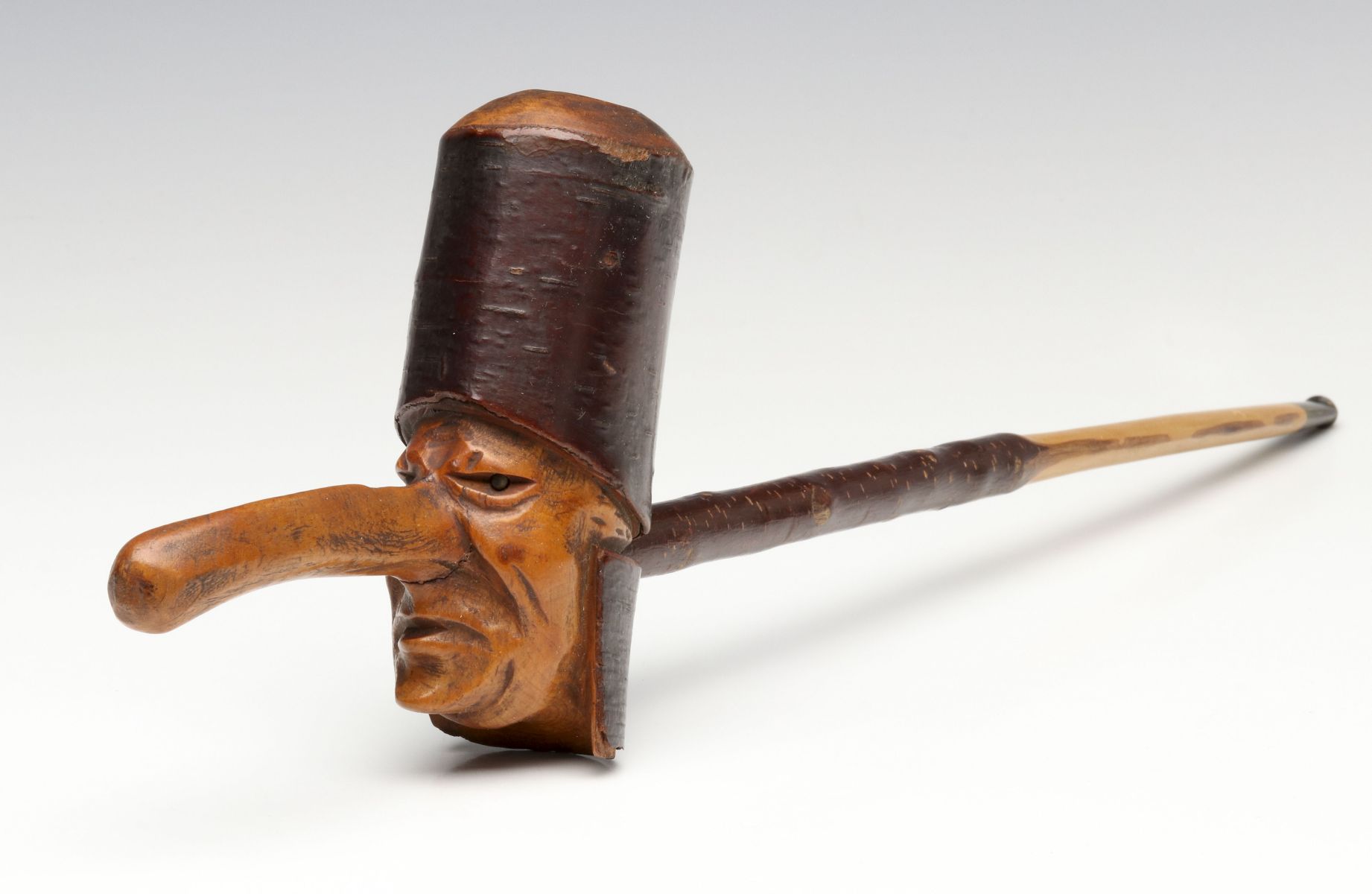 A SWISS FOLK ART CARVED WOOD CARICATURE SMOKING PIPE