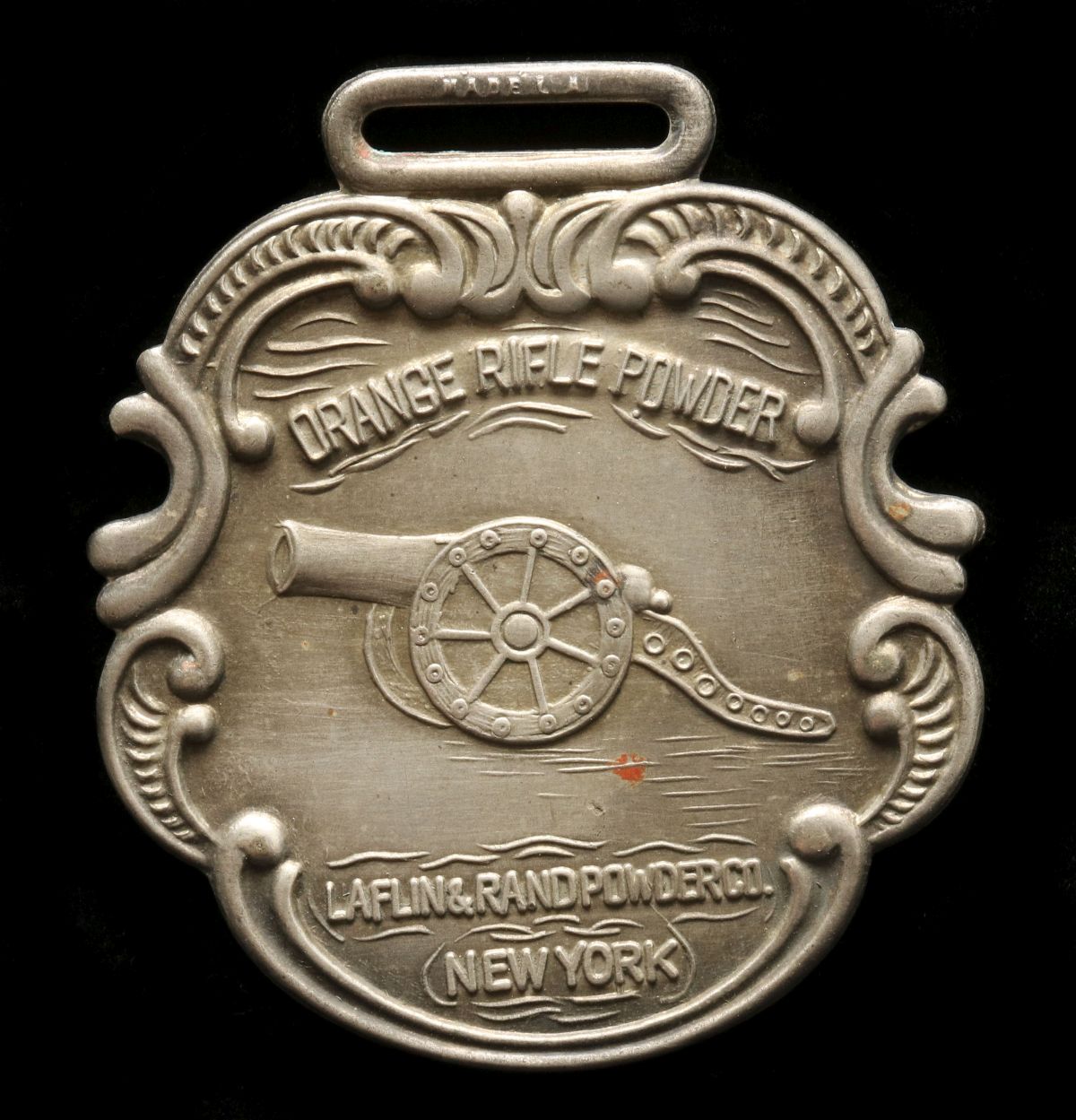 A LAFLIN & RAND 'ORANGE RIFLE POWDER' WATCH FOB