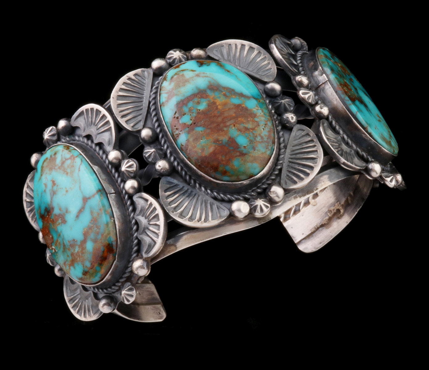 A GILBERT TOM BISBEE TURQUOISE THREE STONE BRACELET