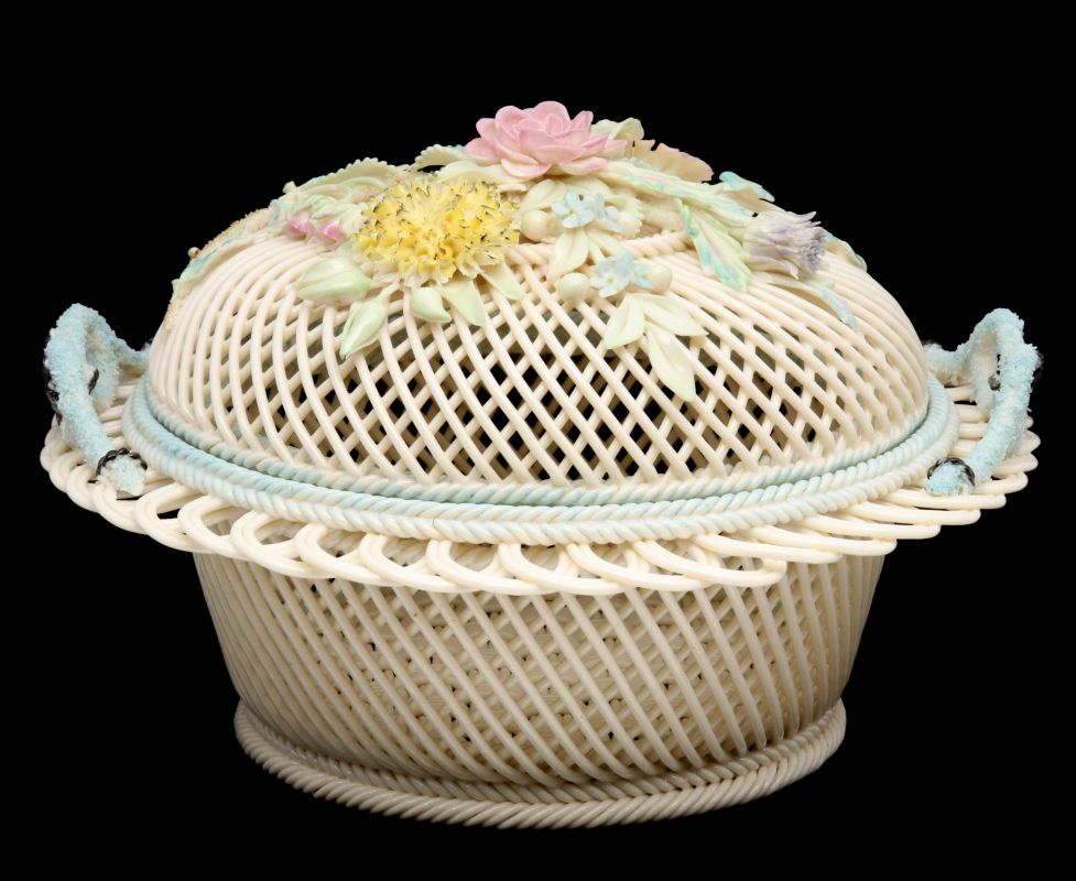 AN IRISH BELLEEK FOUR STRAND PORCELAIN BASKET WITH LID