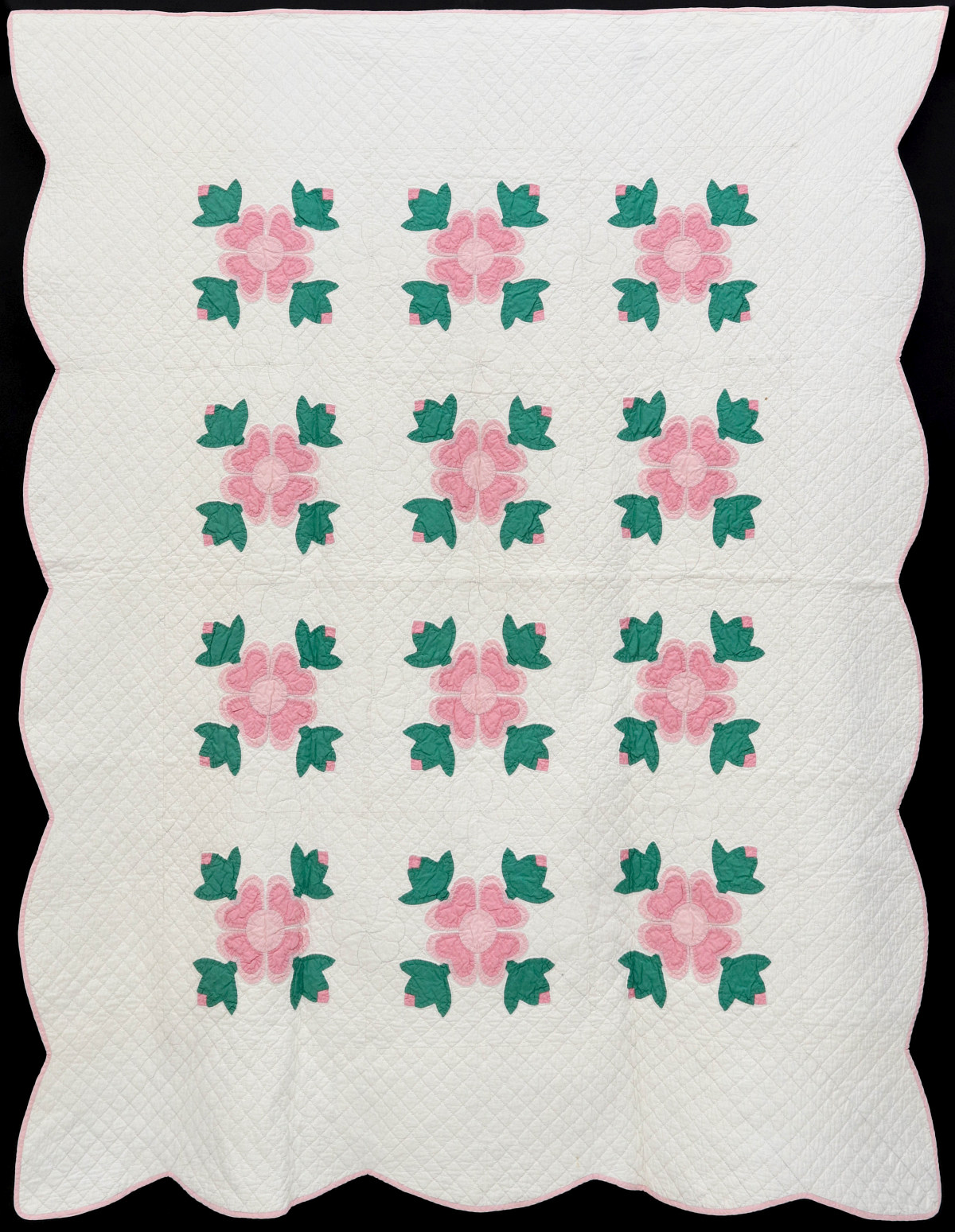 #174: A NICE PINK AND GREEN APPLIQUE CROSSED TULIPS QUILT