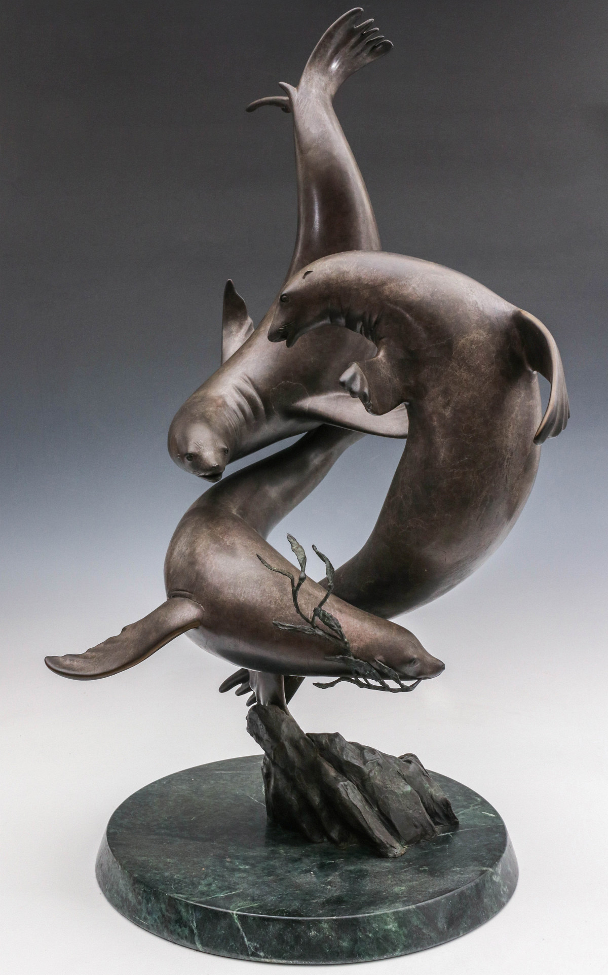 A RICHARD STIERS BRONZE SCULPTURE TITLED SEAL BALLET