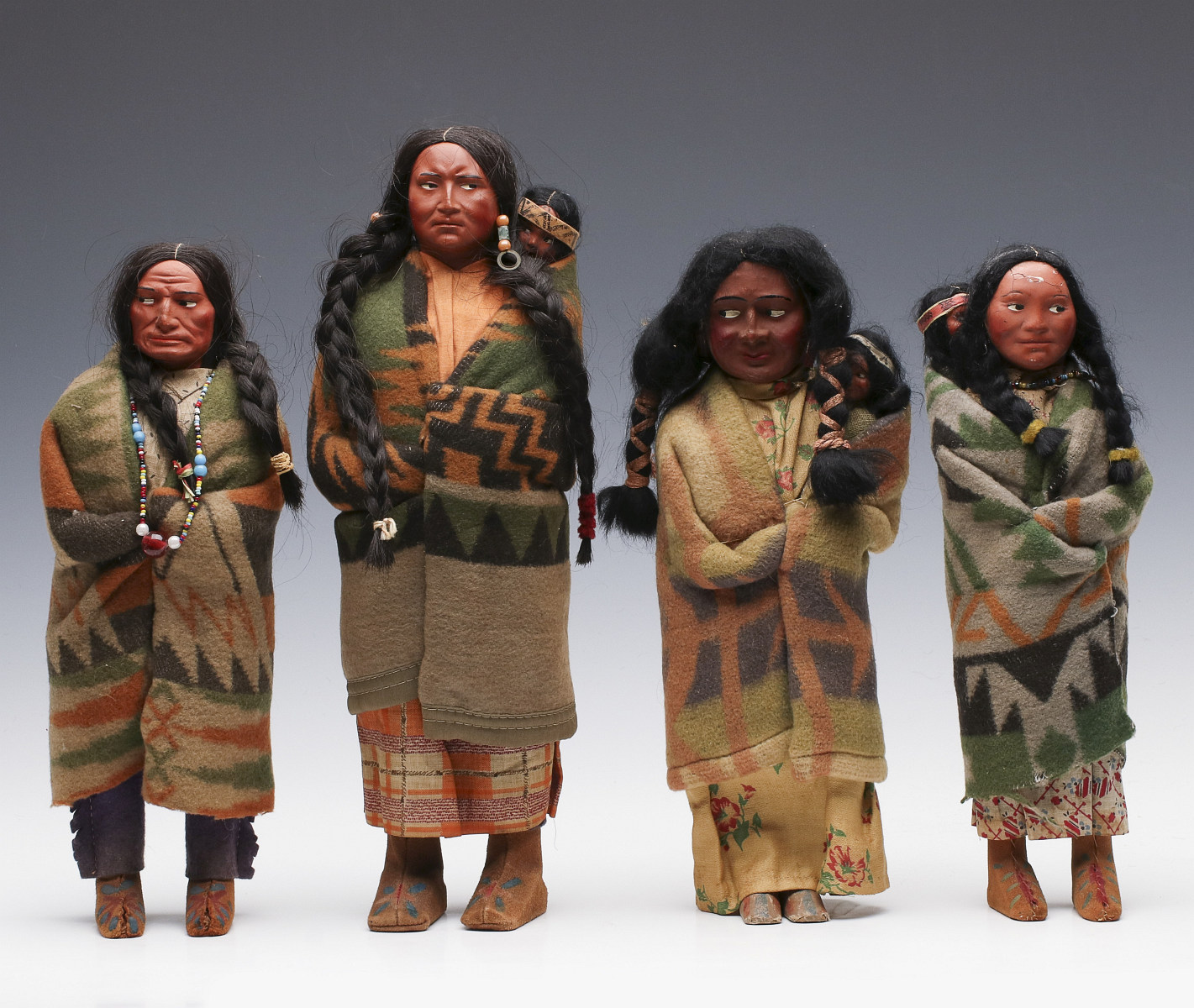 FOUR SKOOKUM INDIAN DOLLS CIRCA 1920