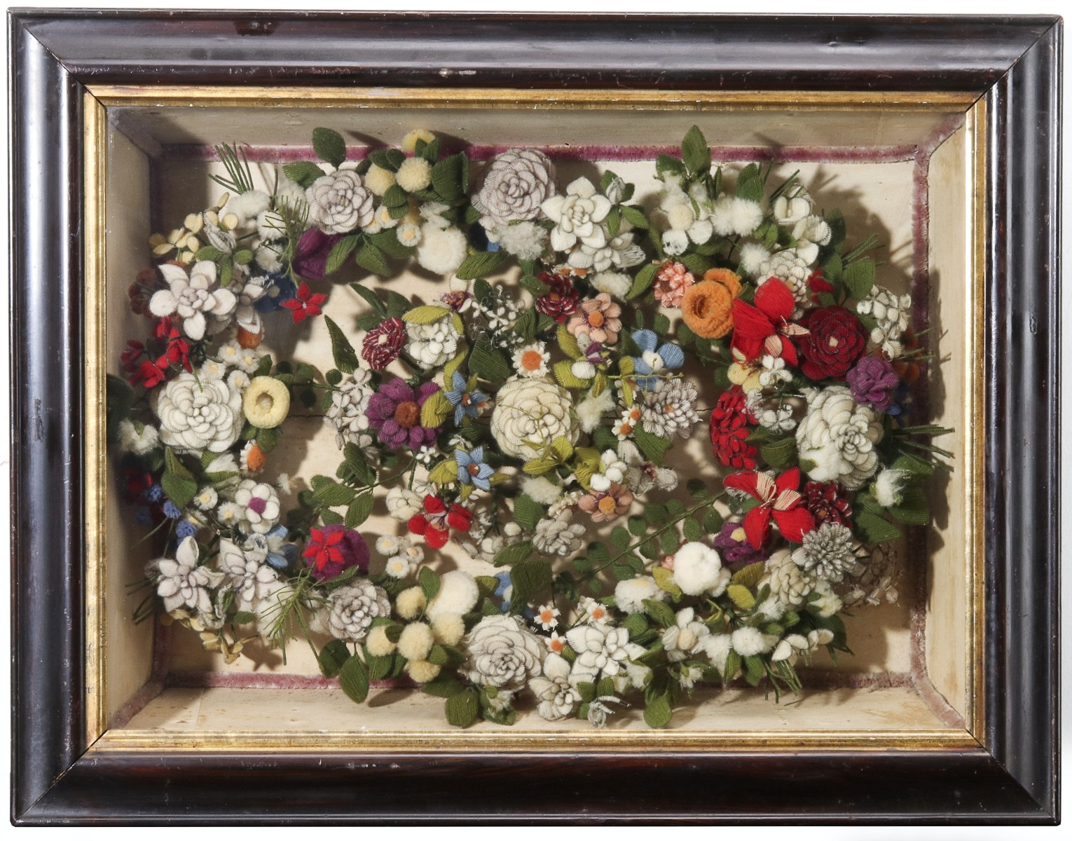 AN ELABORATE VICTORIAN WOOL WORK WREATH