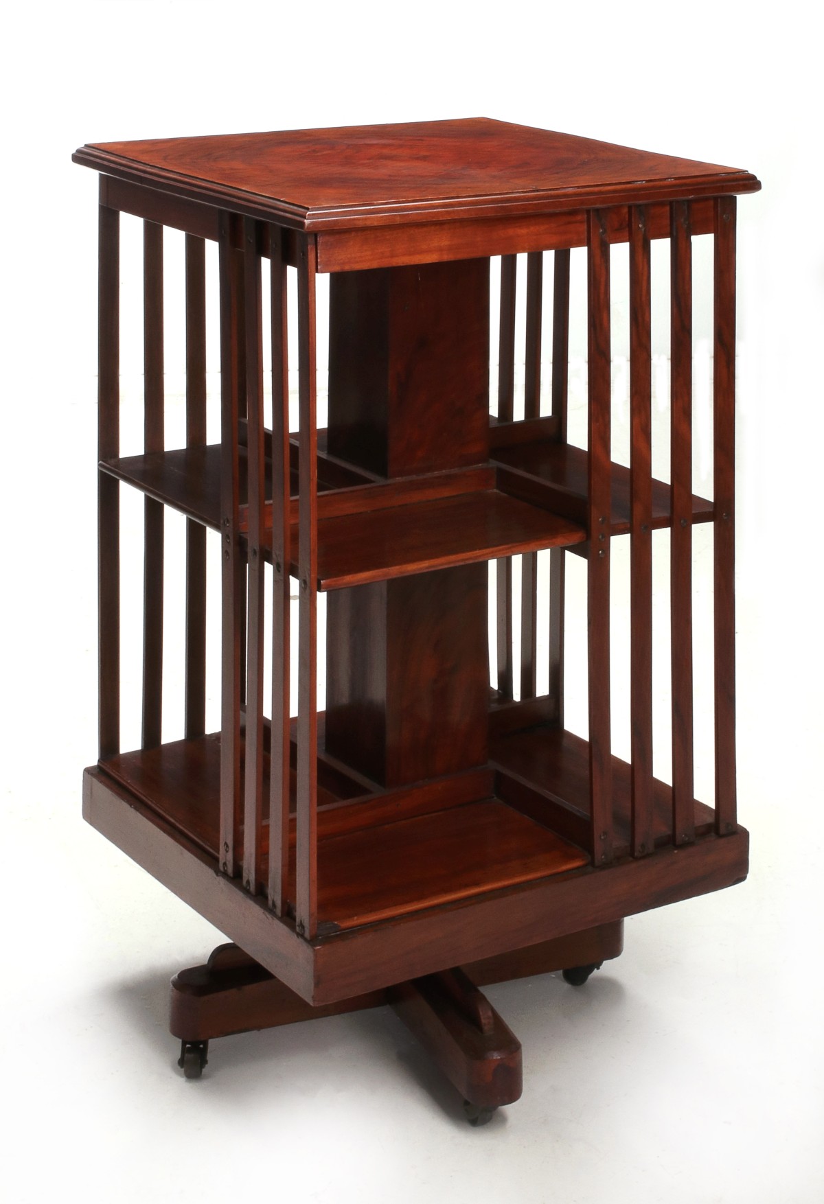 A SMALL WALNUT REVOLVING BOOKCASE CIRCA 1910