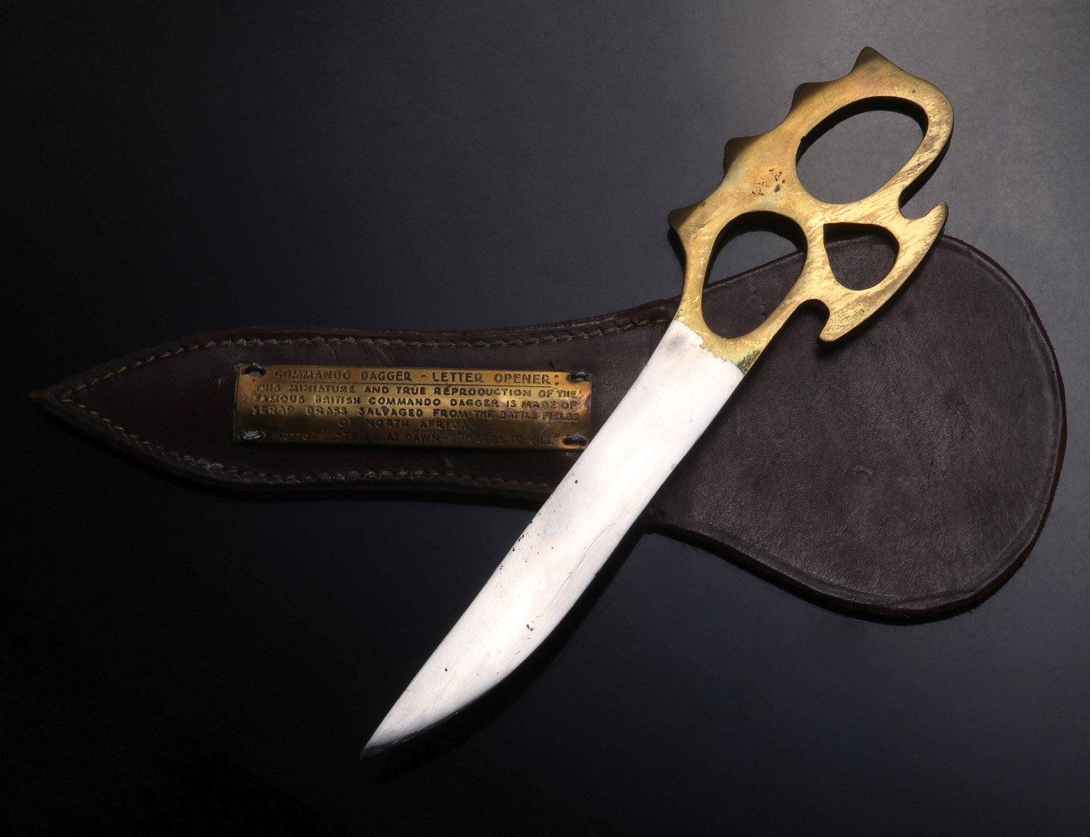 SHRAPNEL HANDLE AND A COMMEMORATIVE COMMANDO DAGGER