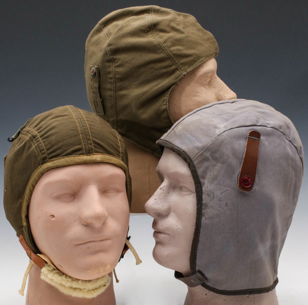 THREE WWII CLOTH FLIGHT HELMETS