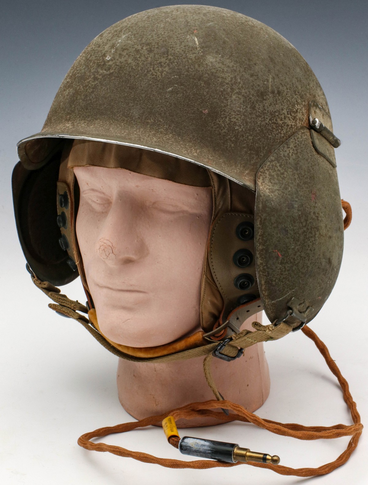 A WWII M5 FLAK HELMET AND CLOTH FLIGHT HELMET