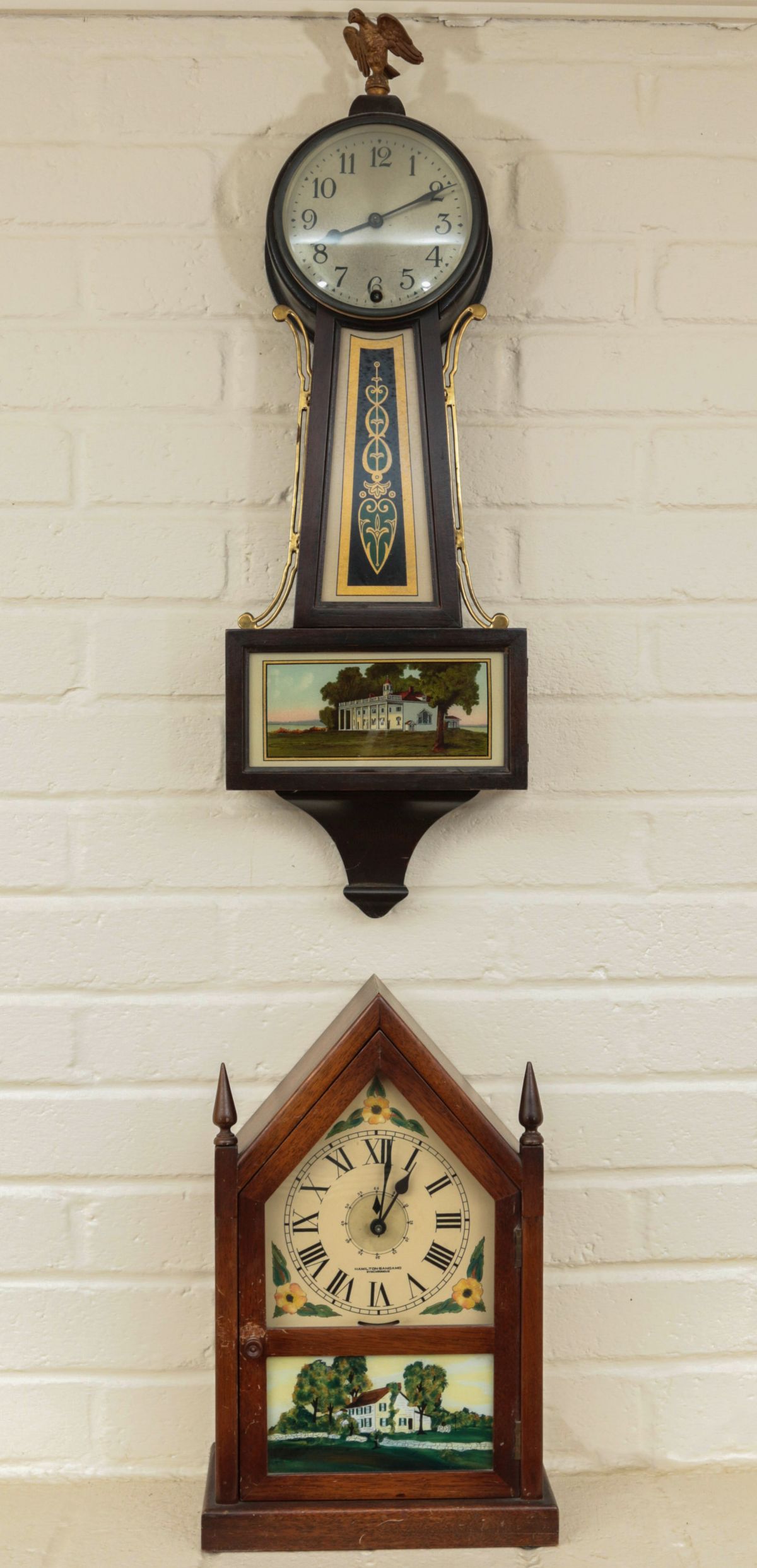 A WATERBURY BANJO CLOCK WITH HAMILTON COTTAGE TYPE