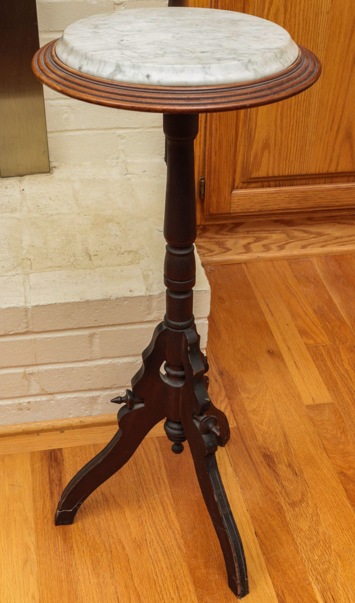 A VICTORIAN WALNUT PLANT STAND WITH MARBLE TOP