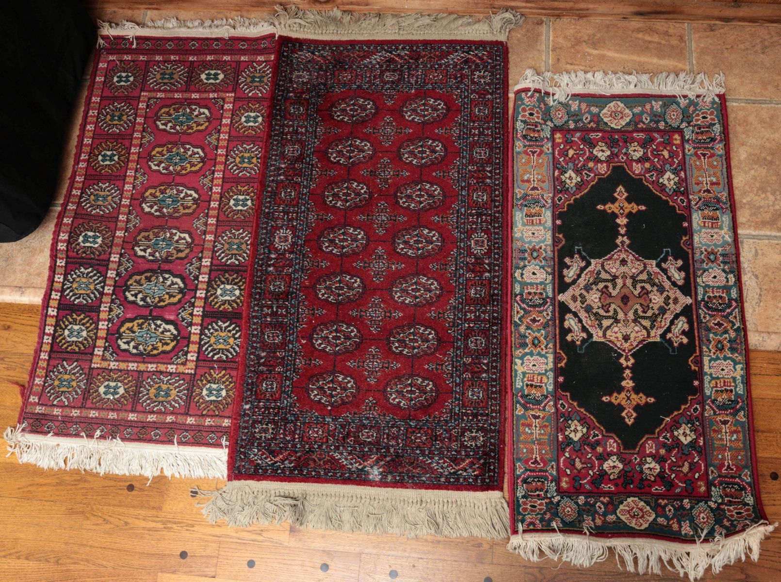 THREE SMALLER MACHINE MADE SCATTER RUGS