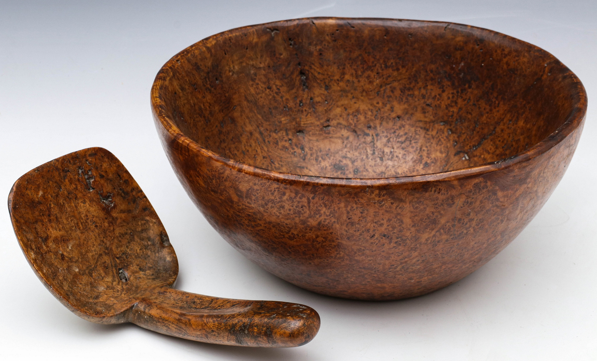 A HIGHLY FIGURED AND HANDSOMELY PATINATED BURL BOWL