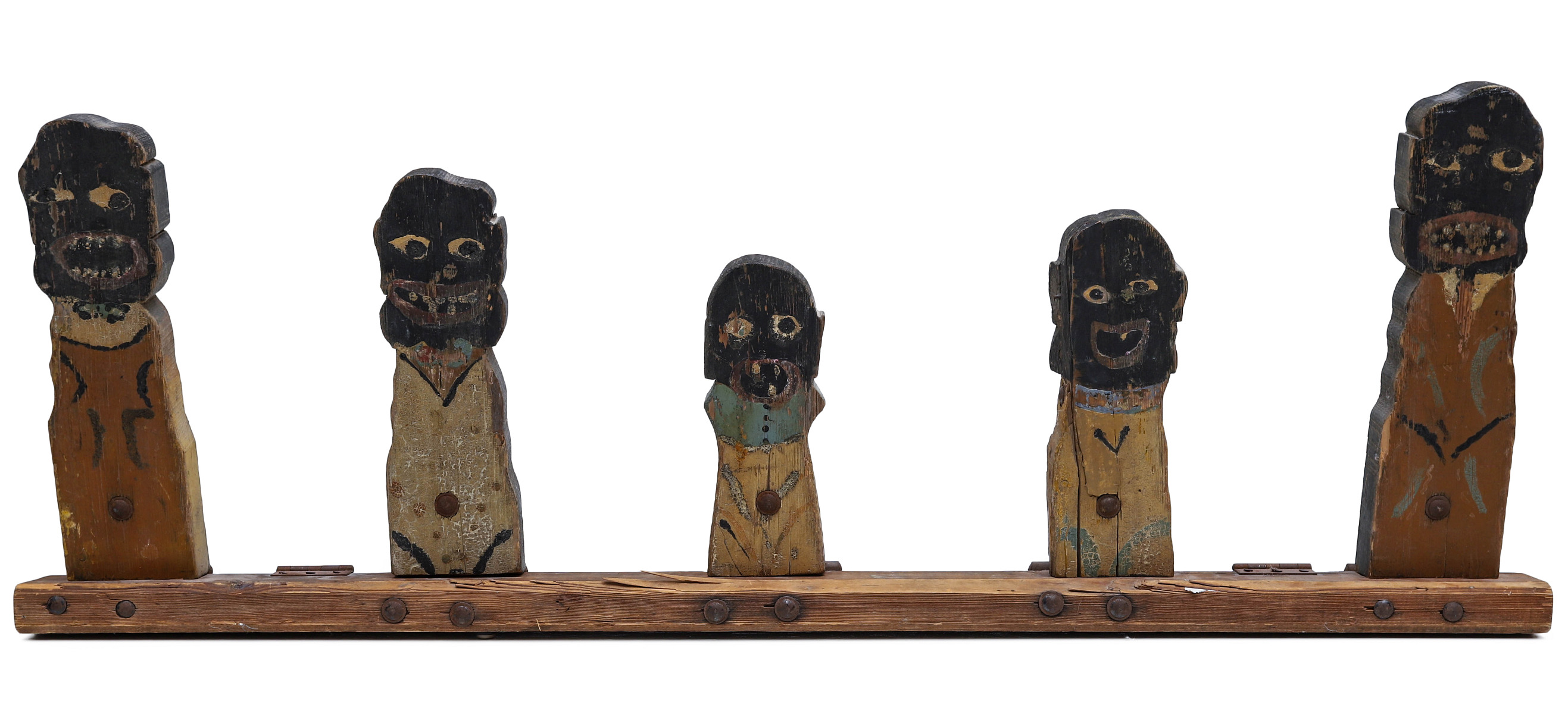 AN ARRANGEMENT OF FIVE PAINTED WOOD KNOCKDOWN FIGURES