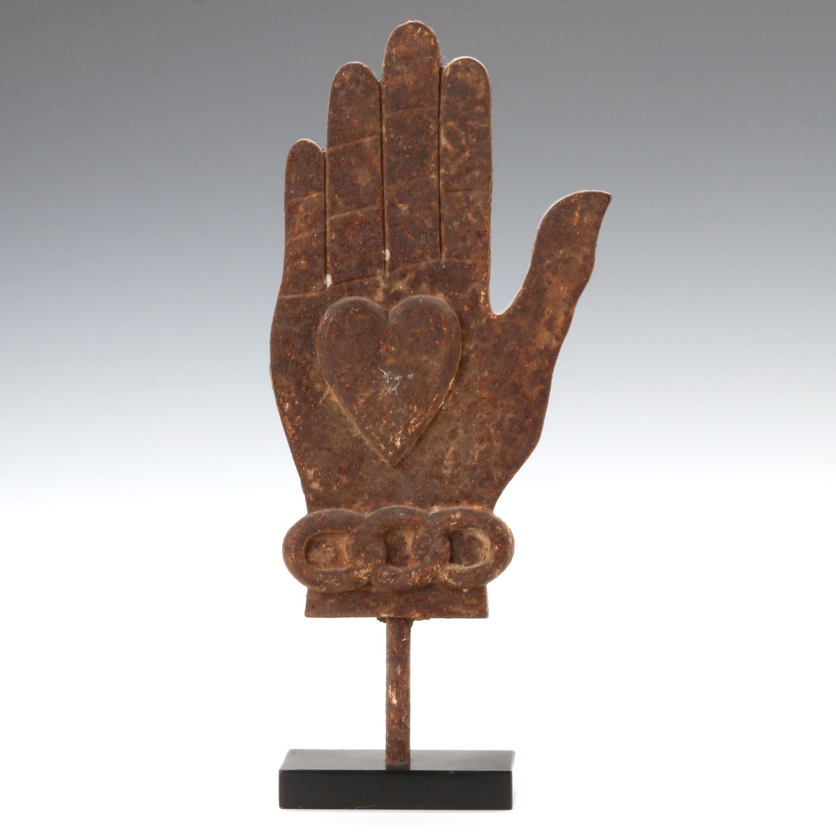 A CAST IRON ODD FELLOWS HEART AND HAND SYMBOL C. 1890