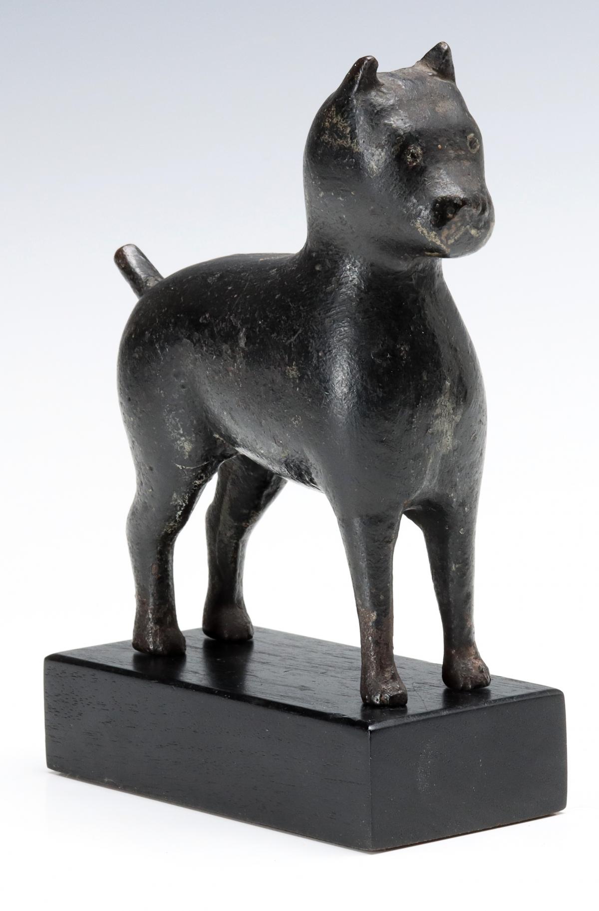 A LATE 19TH CENTURY FOLK ART CAST IRON DOG FIGURE