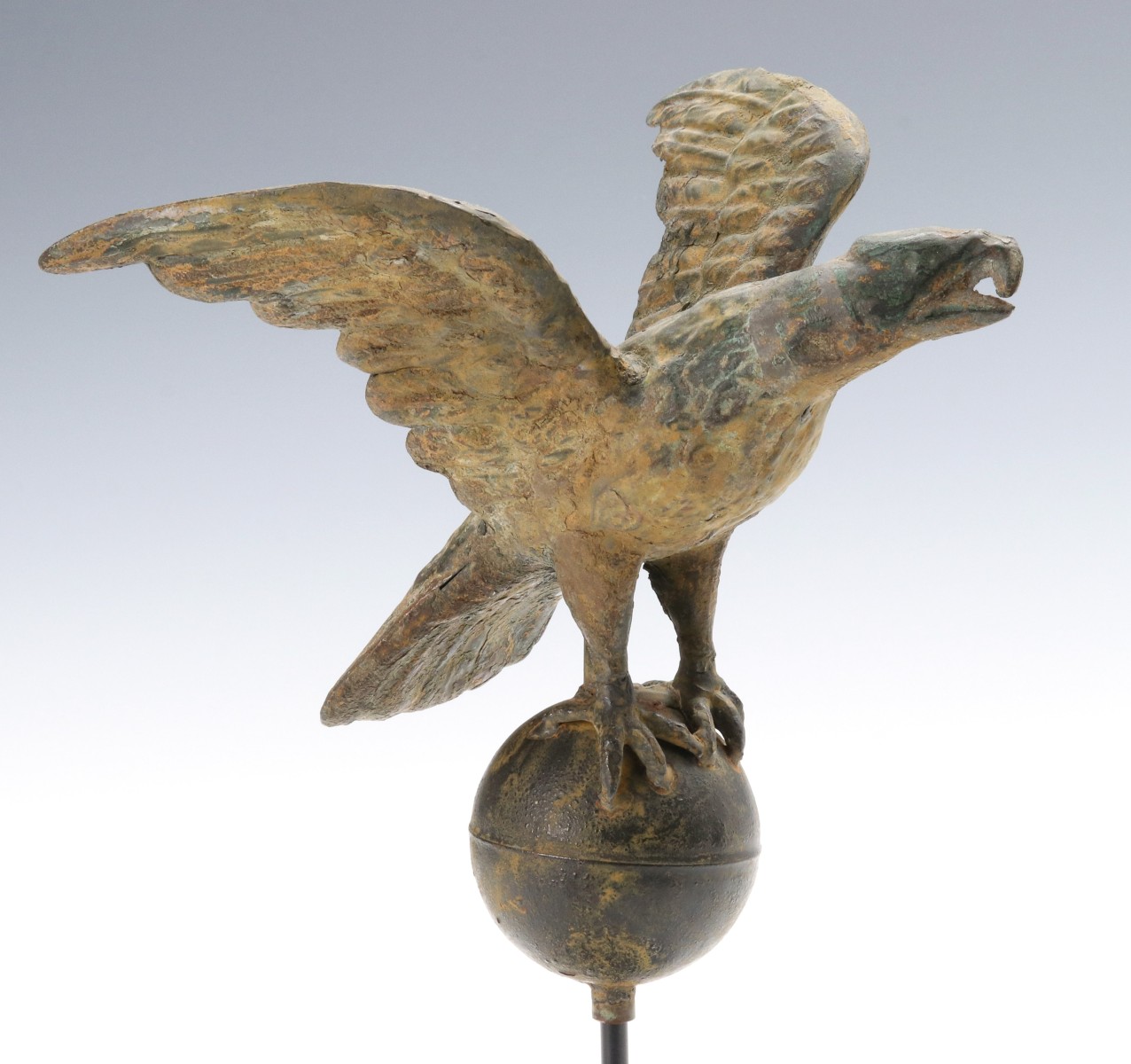 A 19TH CENTURY MOLDED COPPER FLAG POLE EAGLE