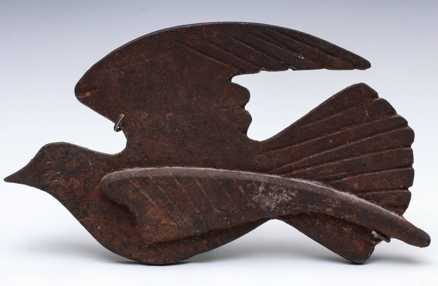 AN EARLY 20TH C. CAST IRON STYLIZED MODEL OF A DOVE