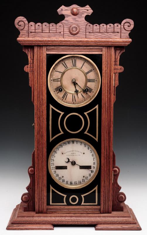 WATERBURY NO. 44 OAK CASE DOUBLE DIAL CALENDAR CLOCK