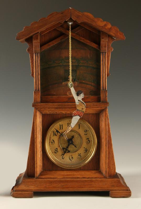 A JUNGHANS 'ACROBAT' GERMAN CLOCK WITH AUTOMATON