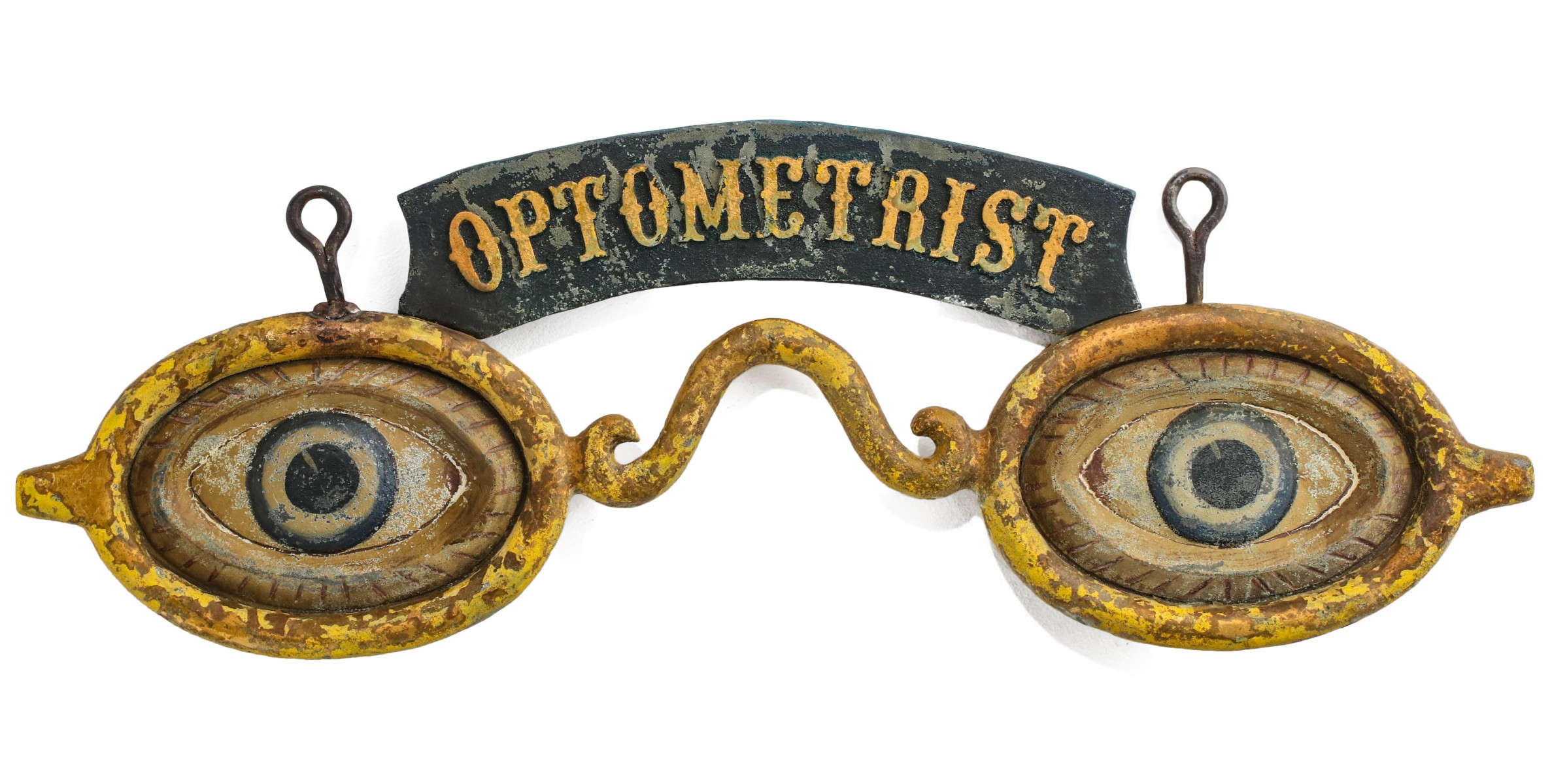 AN UNUSUAL OPTOMETRIST TRADE SIGN WITH EMBOSSED BANNER