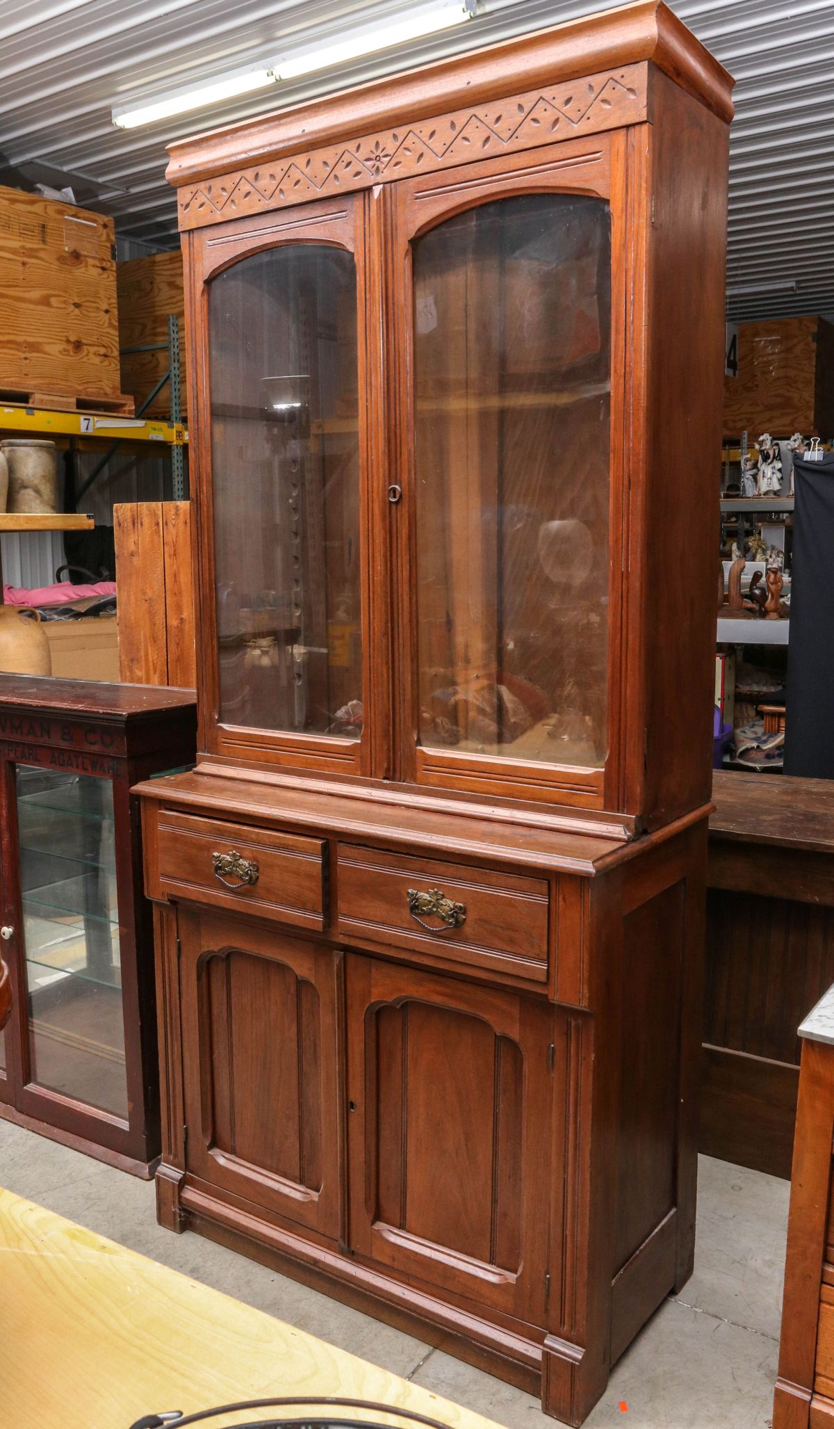 A 19TH CENTURY AMERICAN WALNUT STEP BACK CUPBOARD