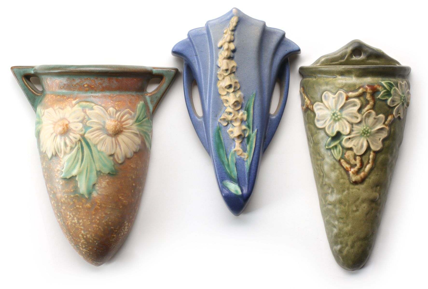 THREE ROSEVILLE ART POTTERY FLORAL PATTERN WALL POCKETS