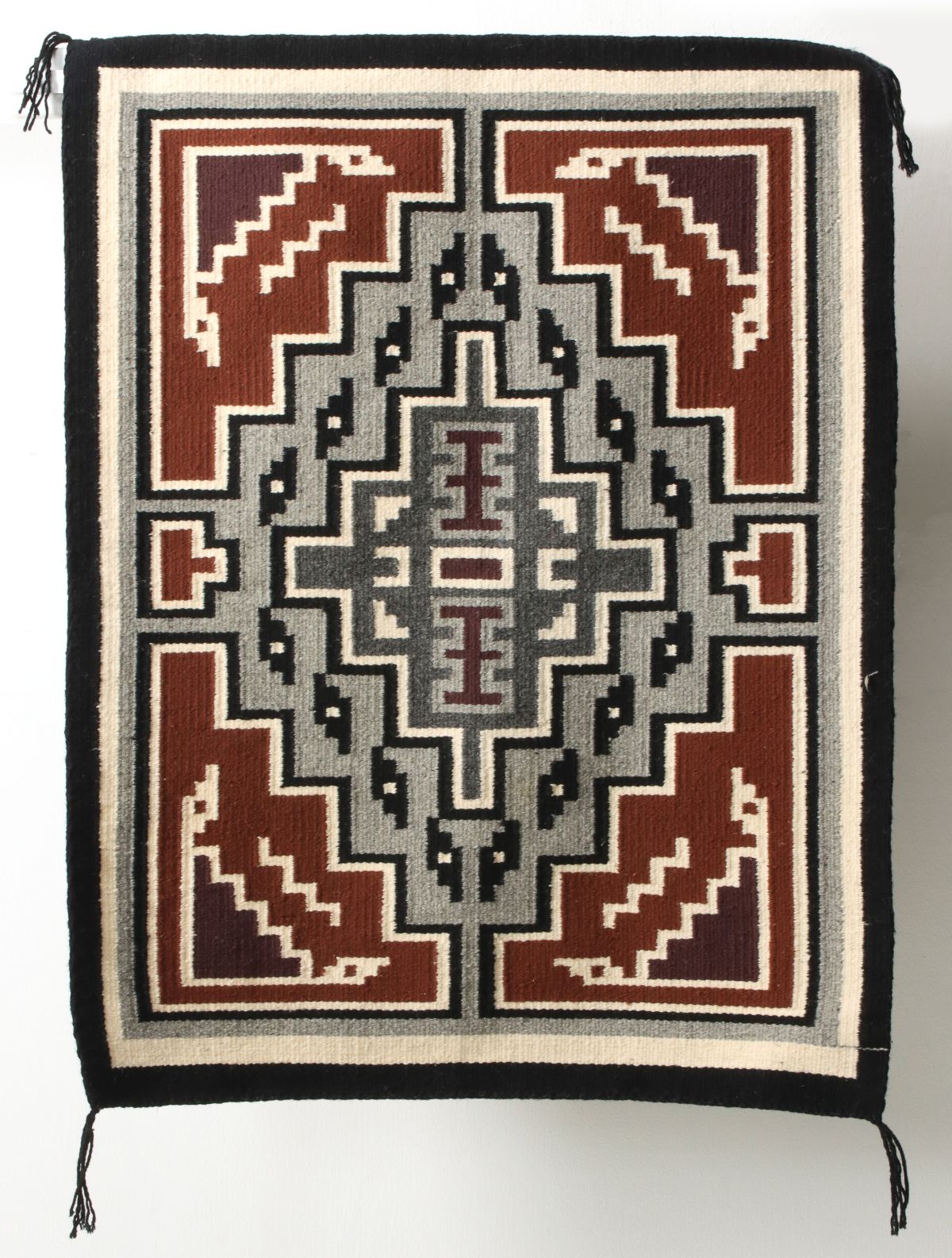 A GOOD FIVE-COLOR 20TH C. TWO GREY HILLS NAVAJO WEAVING