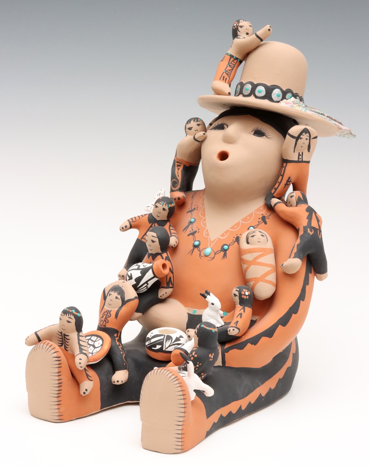 A SANTA CRUZ PUEBLO POTTERY STORYTELLER SIGNED ORTIZ