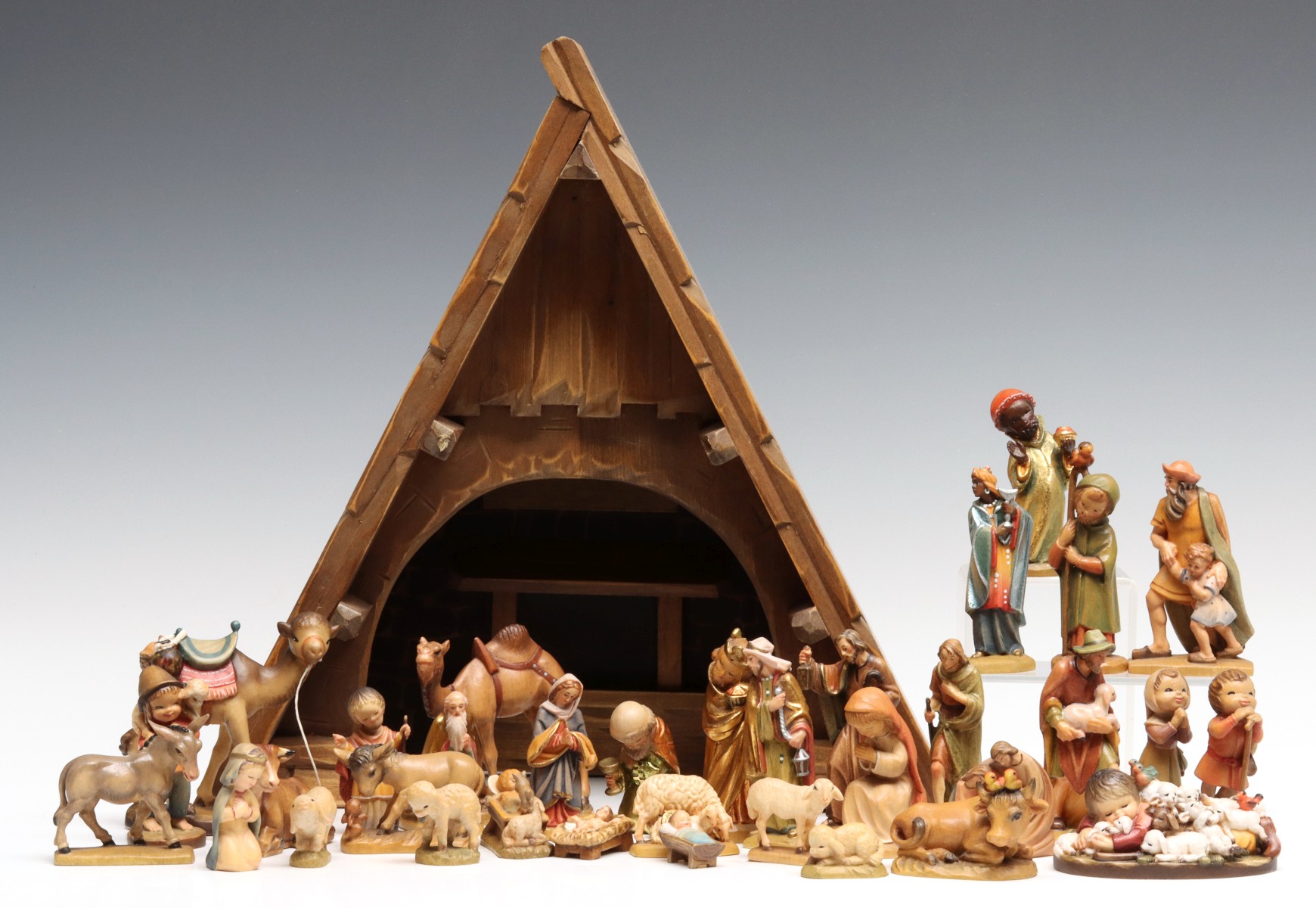 AN ANRI 33 PIECE NATIVITY SET