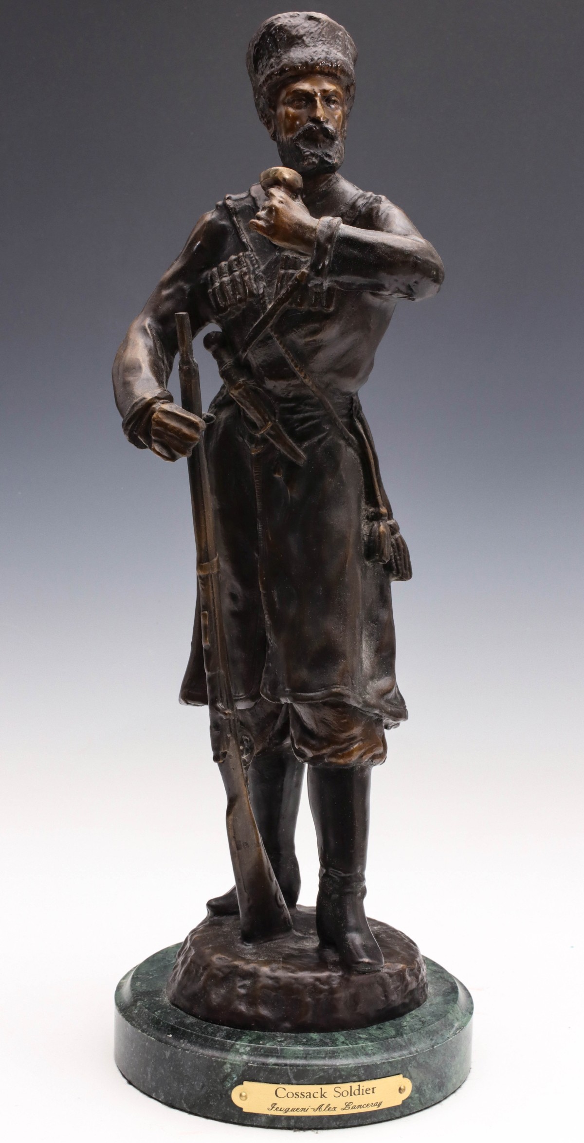 A LATE 20TH CENTURY BRONZE SCULPTURE OF COSSACK SOLDIER