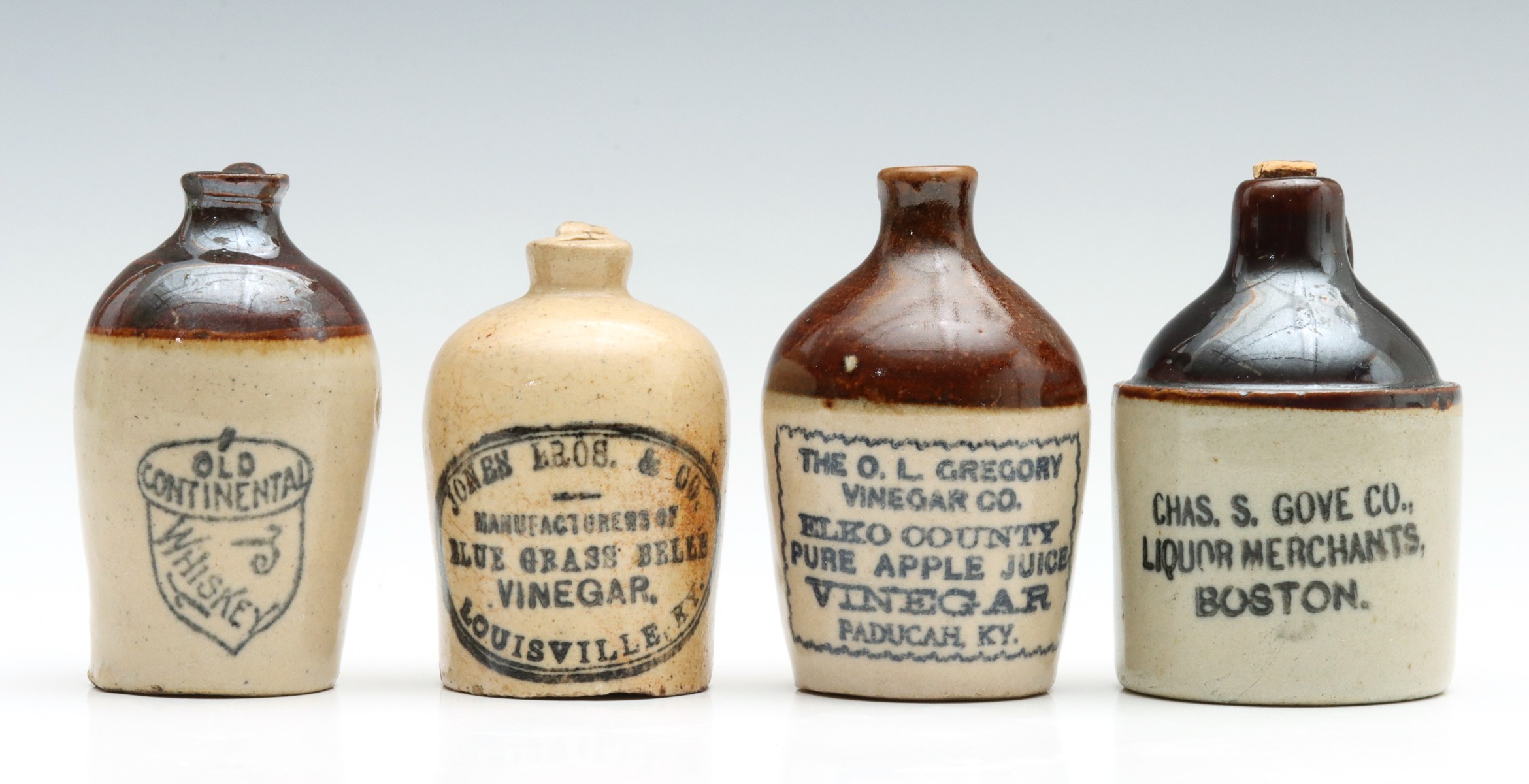 MINIATURE STONEWARE JUGS ADVERTISING LIQUOR AND VINEGAR