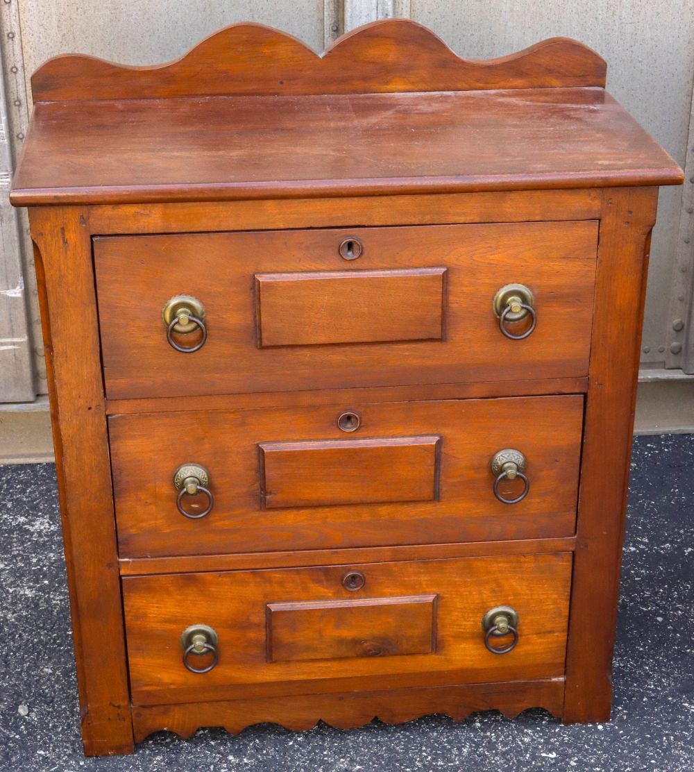 AN ANTIQUE WALNUT THREE DRAWER WASH STAND