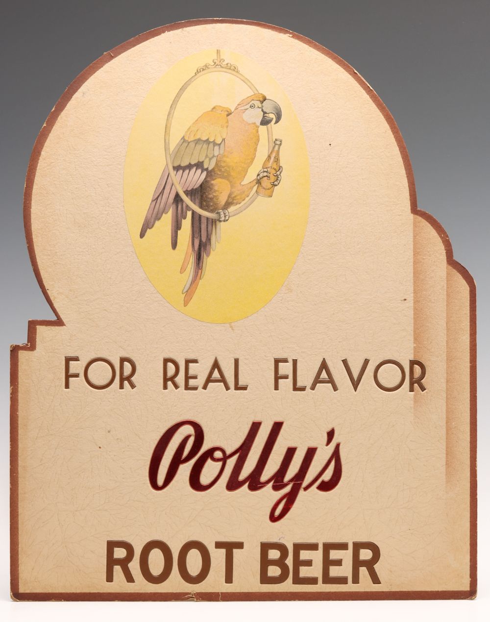 AN ART DECO POLLY'S ROOT BEER DIE CUT ADVERTISING SIGN