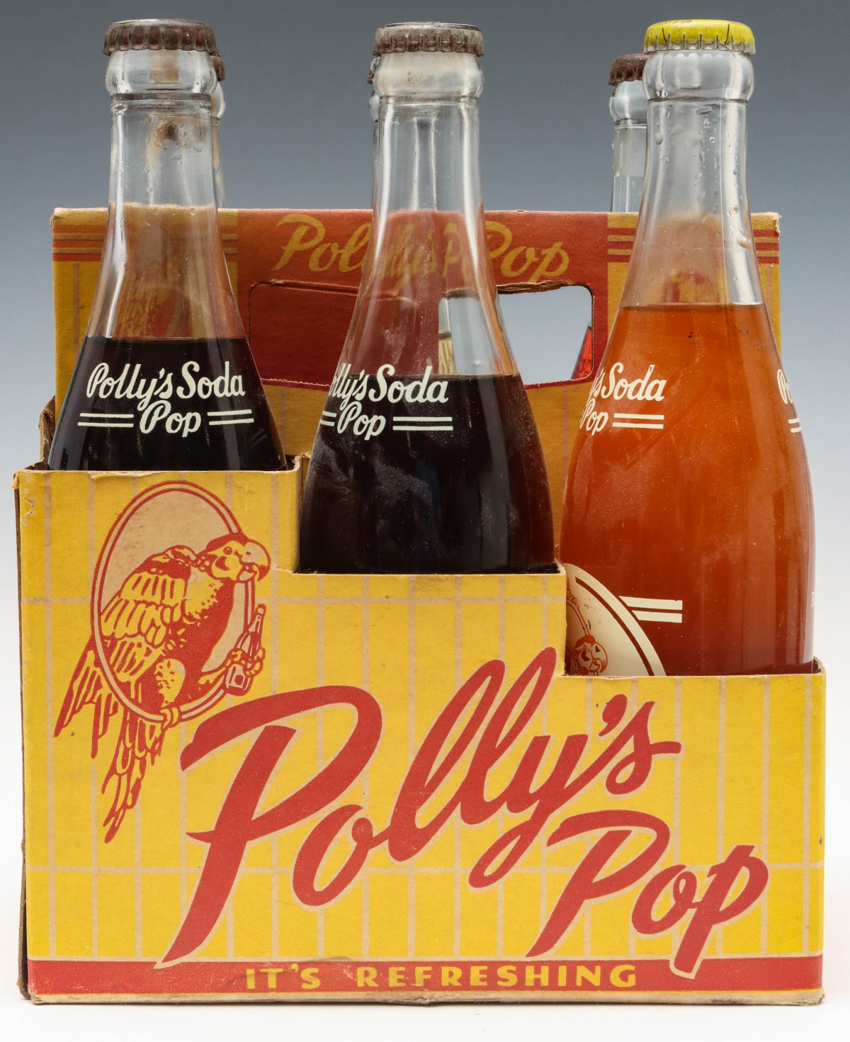 A SIX BOTTLE CARRIER WITH ORIGINAL UNOPENED POLLY'S POP