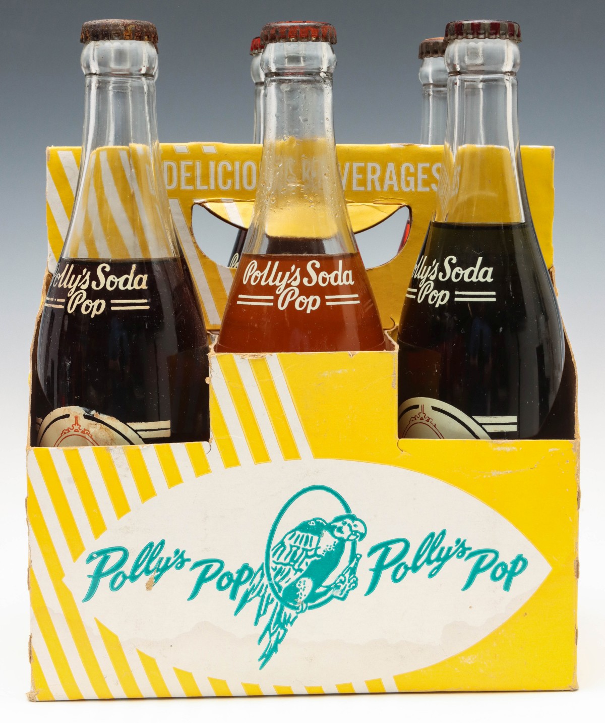 A SIX BOTTLE CARRIER WITH ORIGINAL UNOPENED POLLY'S POP