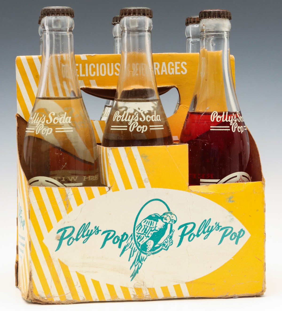 A SIX BOTTLE CARRIER WITH ORIGINAL UNOPENED POLLY'S POP